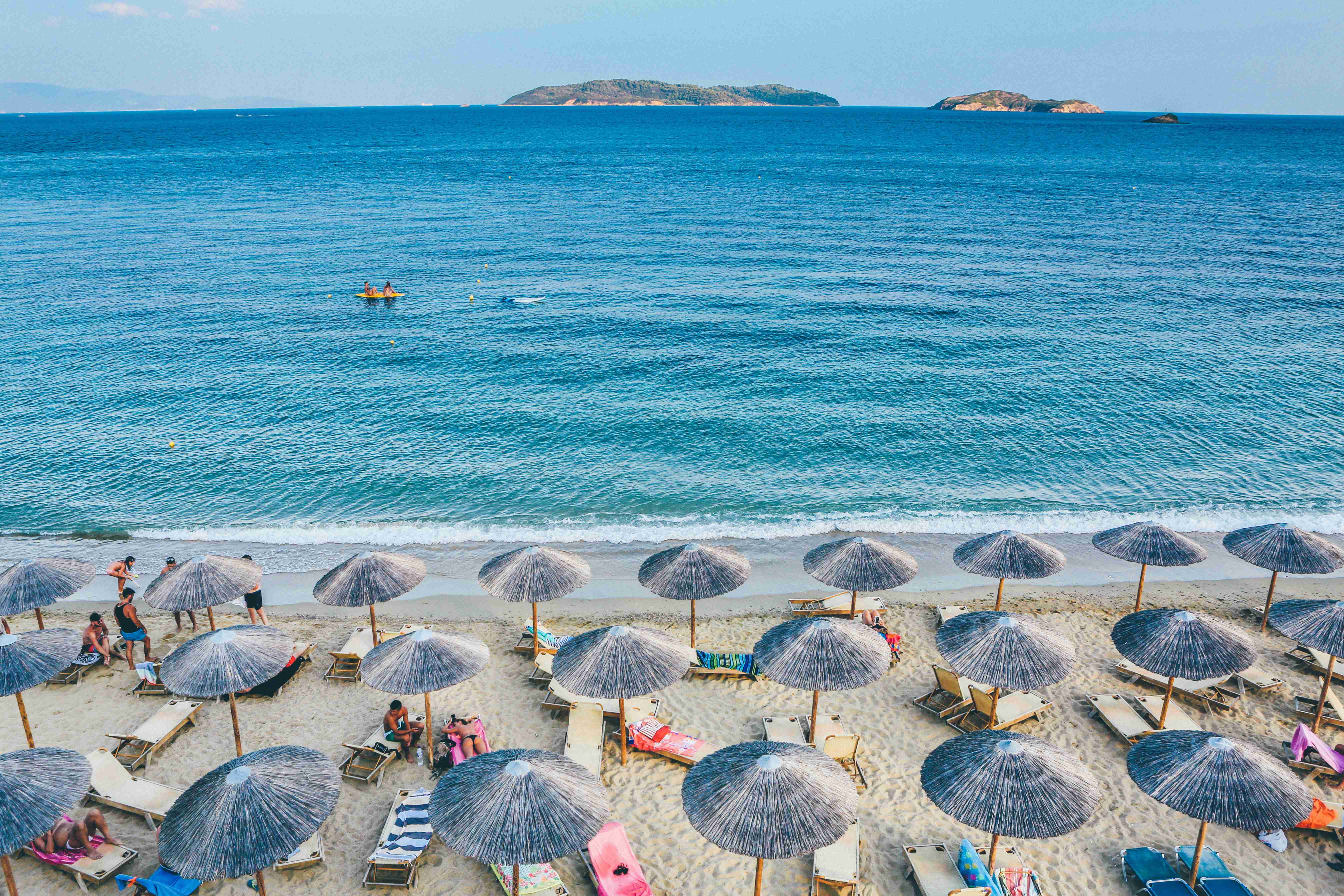 Beachside Leisure Under Straw Umbrellas