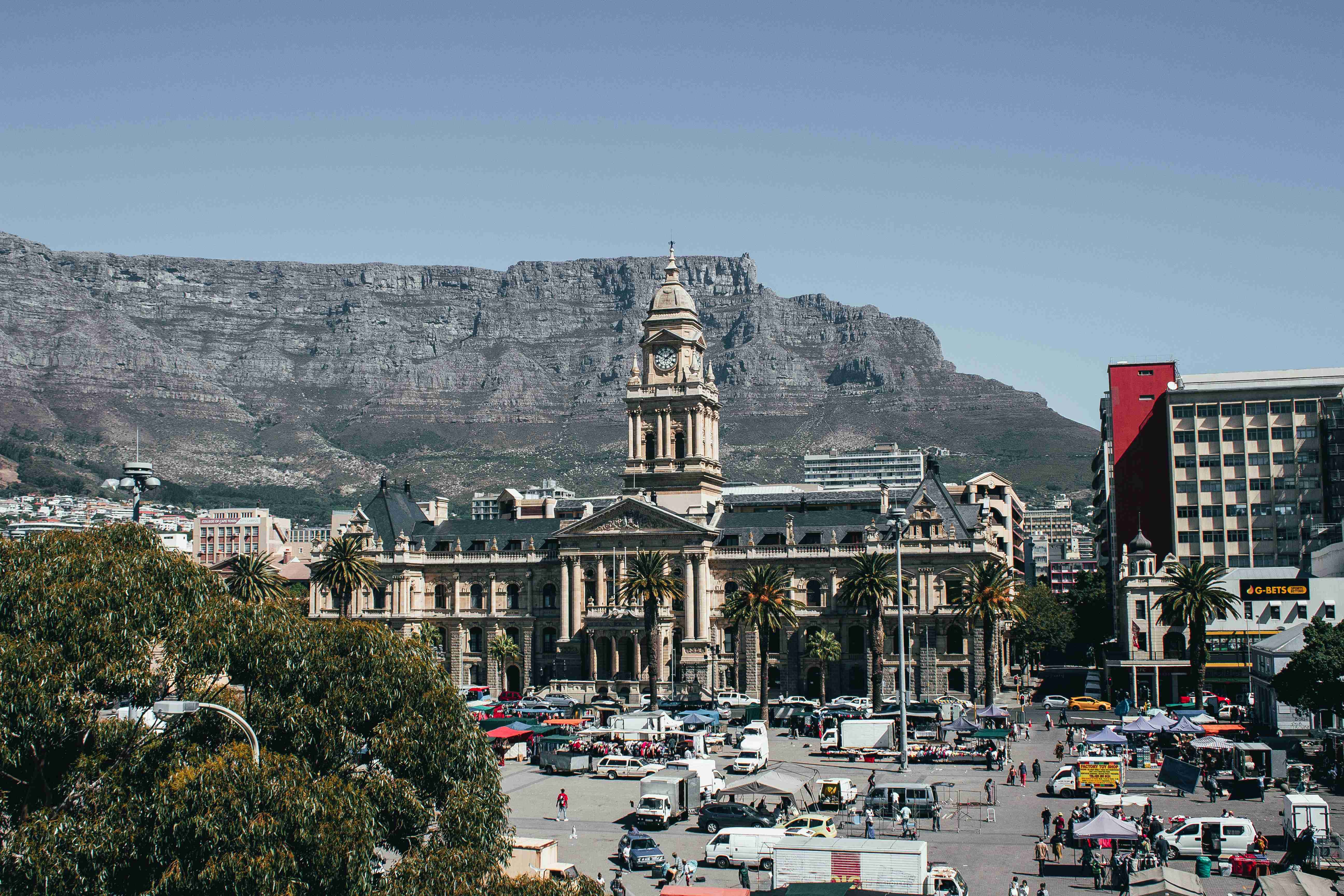 Cityscape with Historic Building and Mountain Backdrop