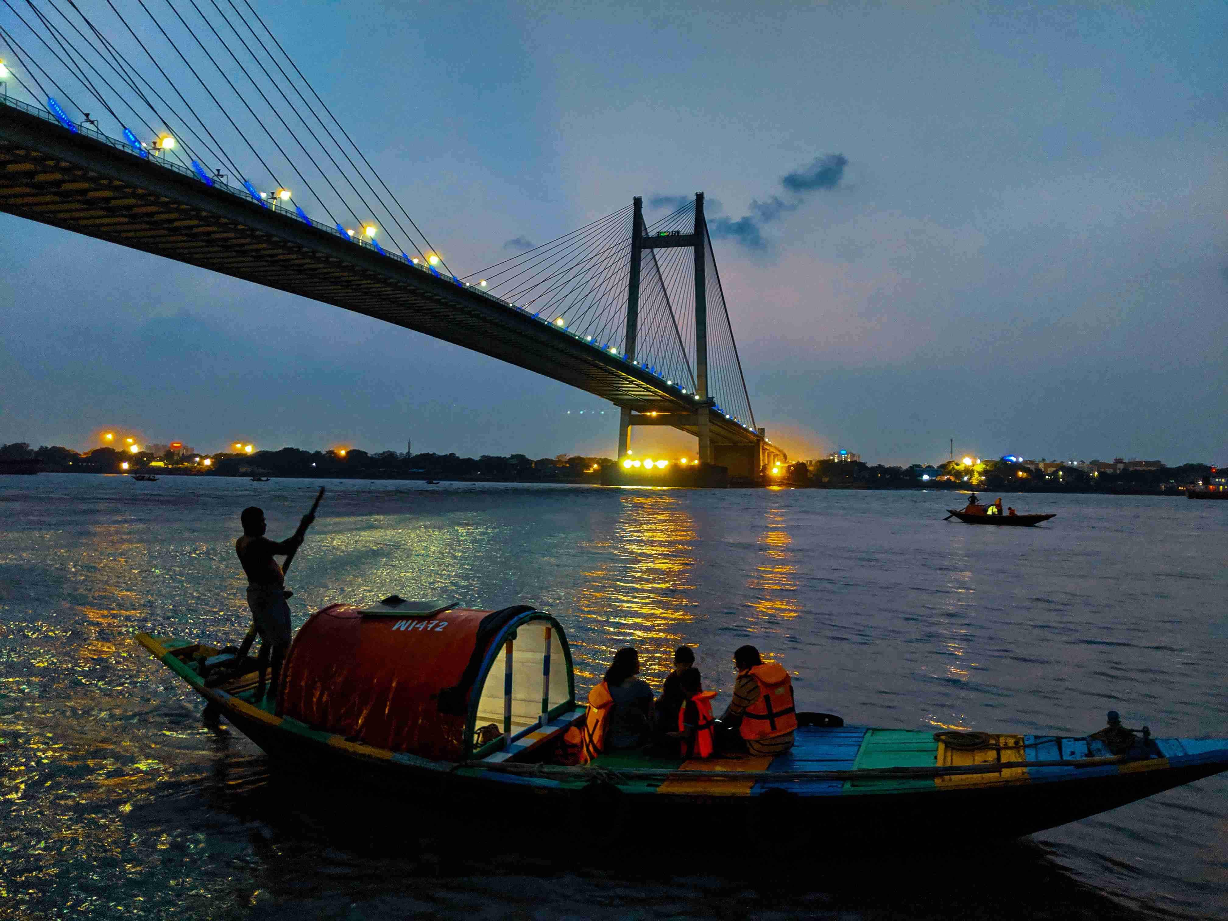 Evening River Scene with Bridge and Boats