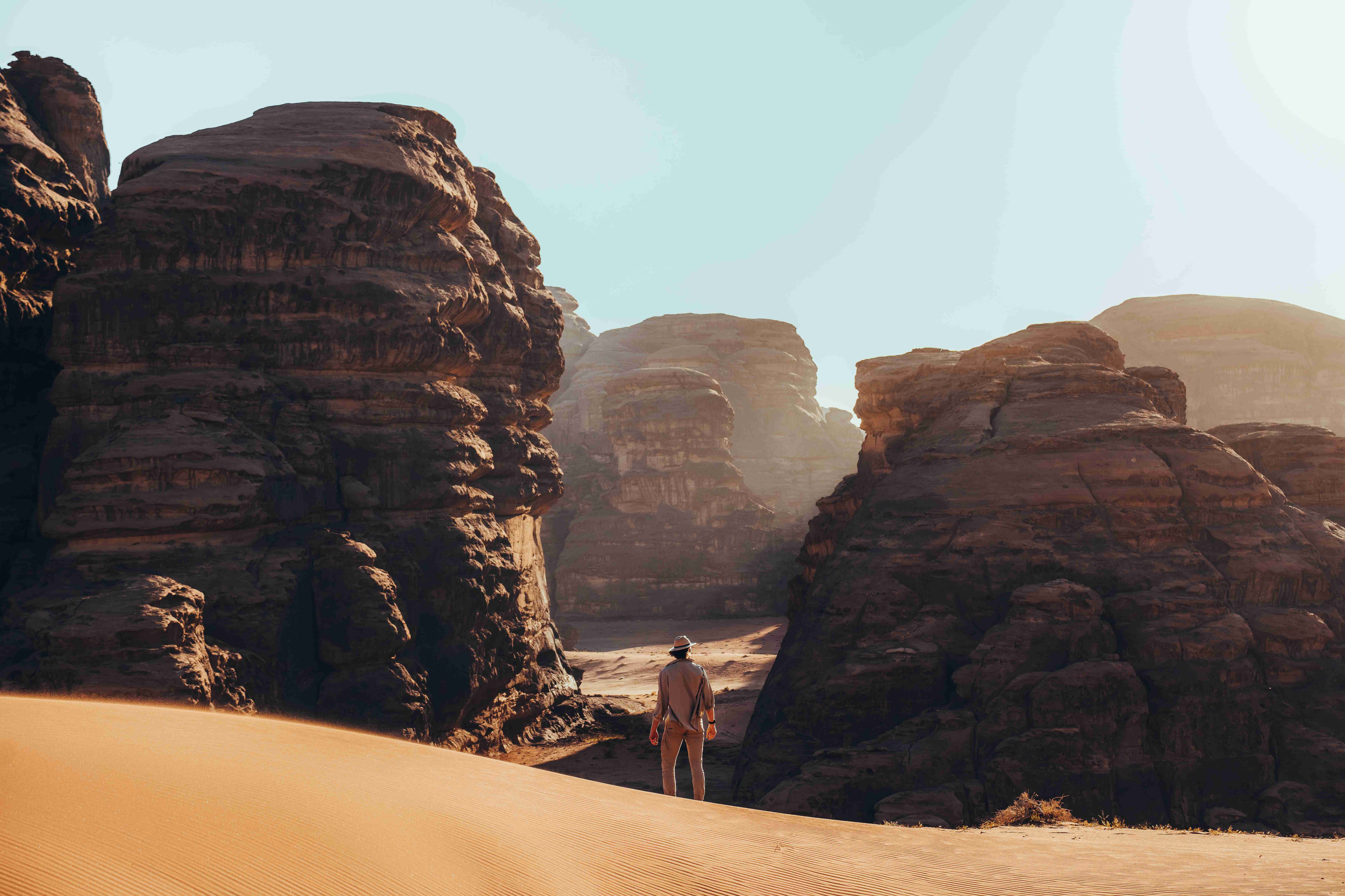Explorer Amidst _Desert _Cliffs