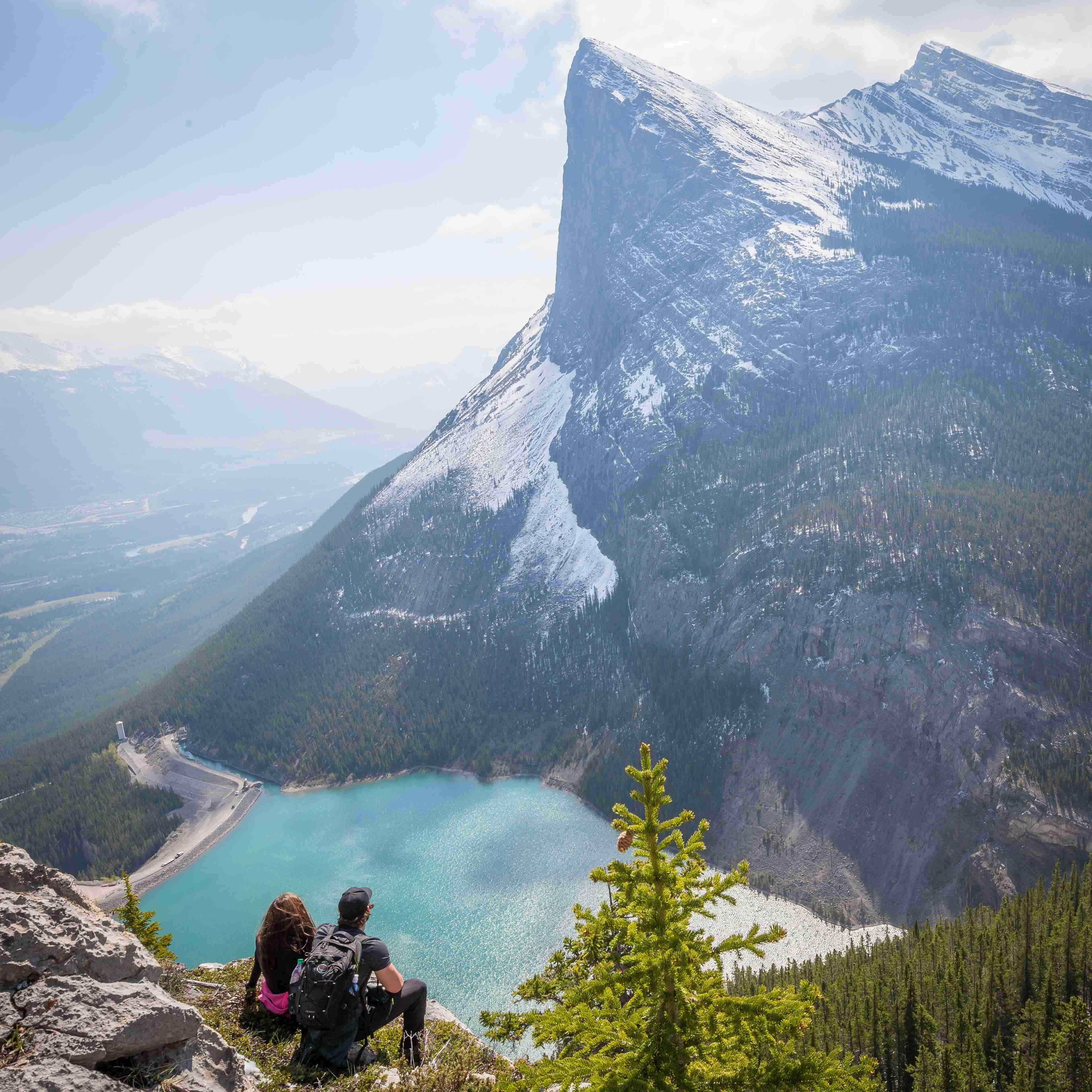 Hikers Overlooking Turquoise Mountain Lake