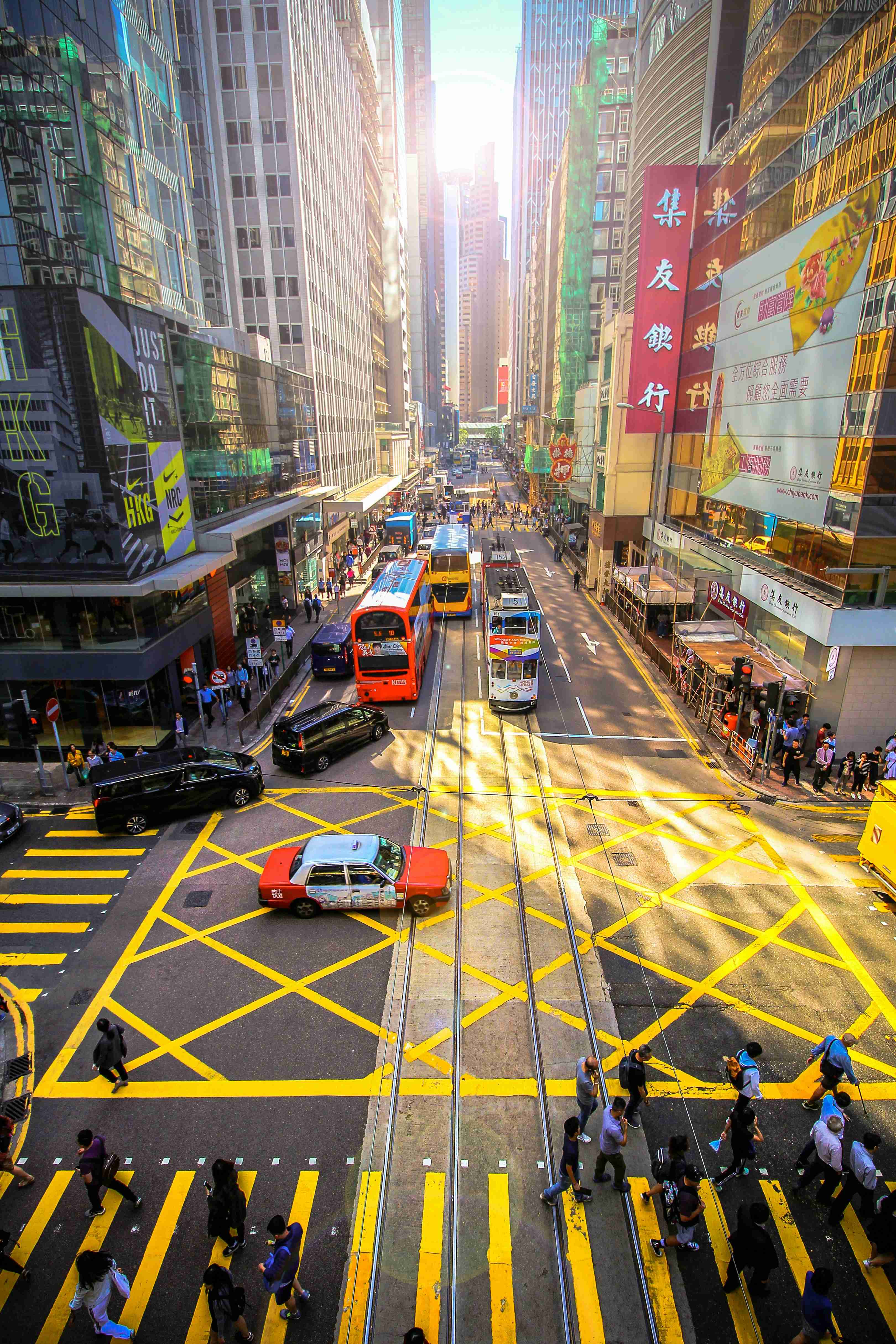 Hong Kong Street Scene with Trams and Pedestrians