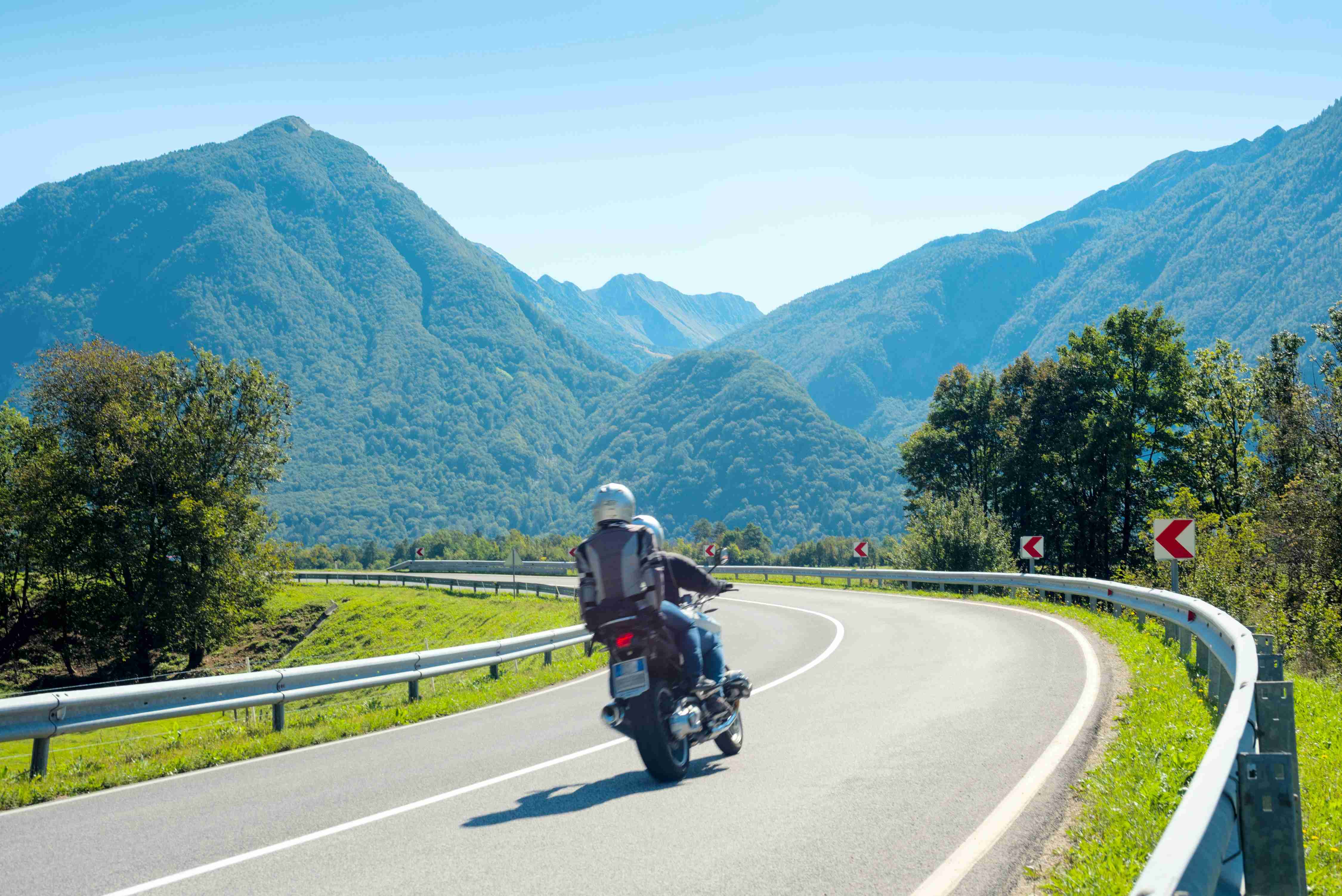 Motorcyclist Riding on Mountain Road