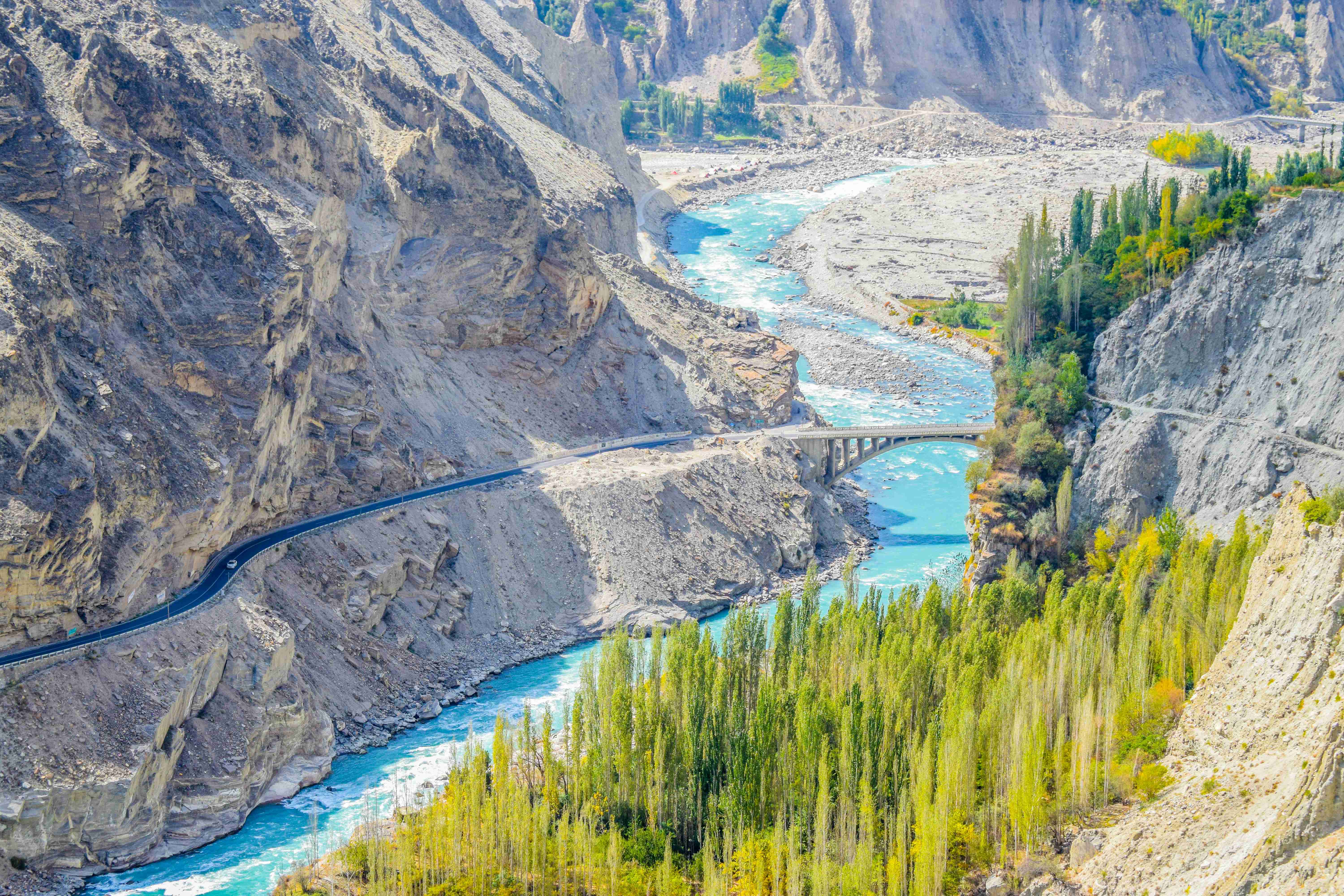 Mountainous Landscape with River and Bridge