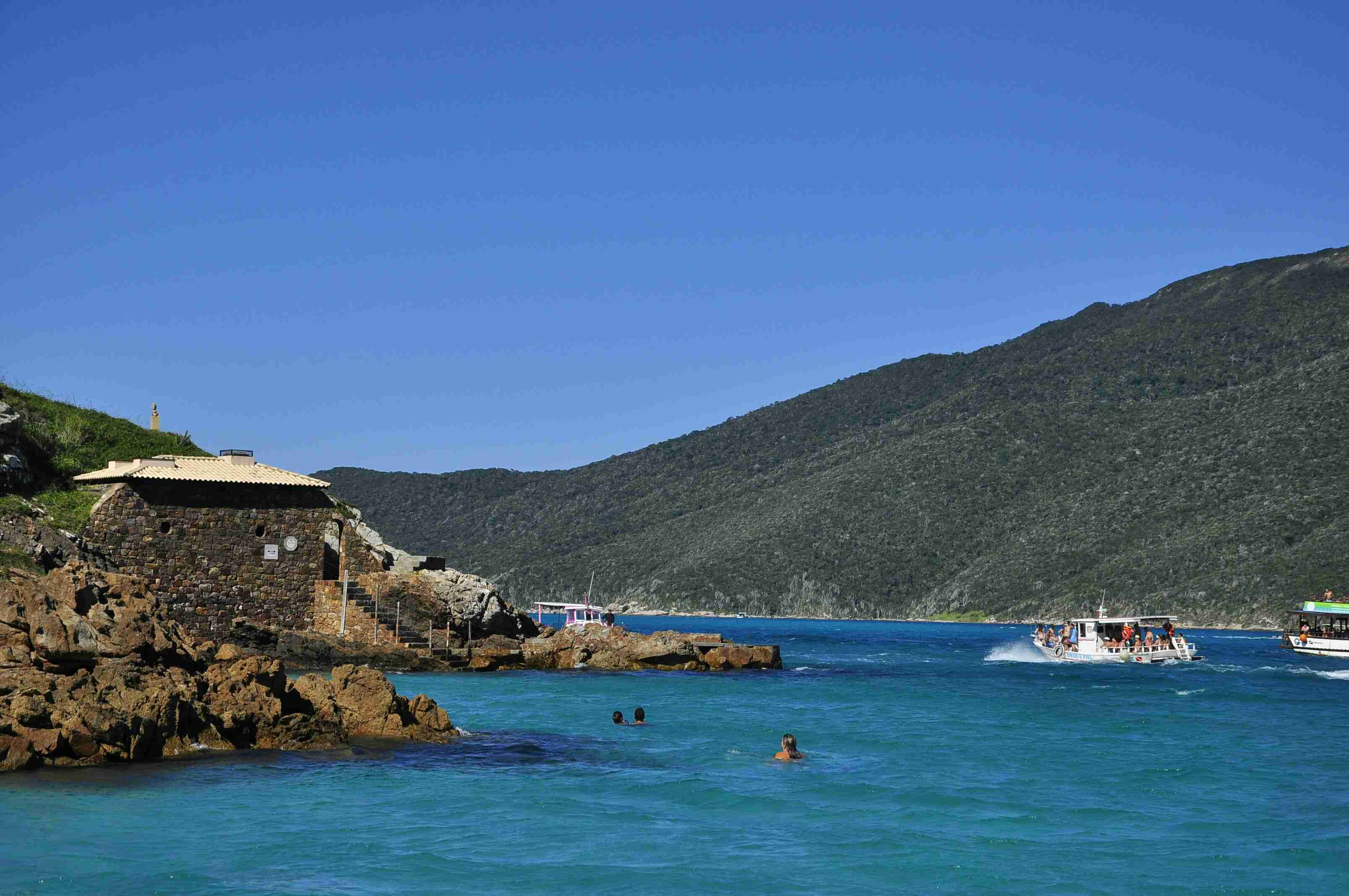 Seaside Hut Against Mountain Backdrop