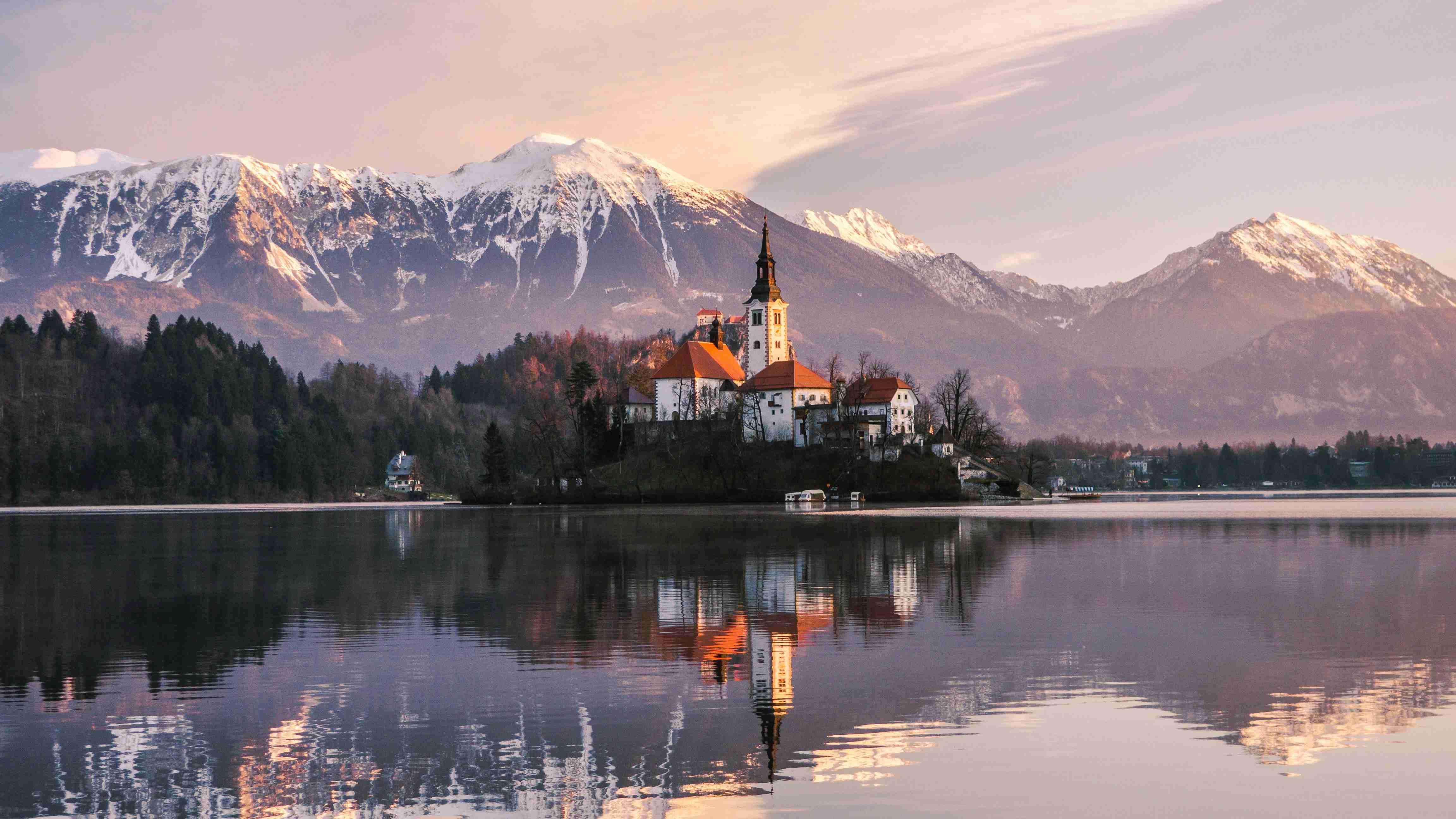 Sunset Reflections on Lake with Snow-Capped Mountains and Island Church