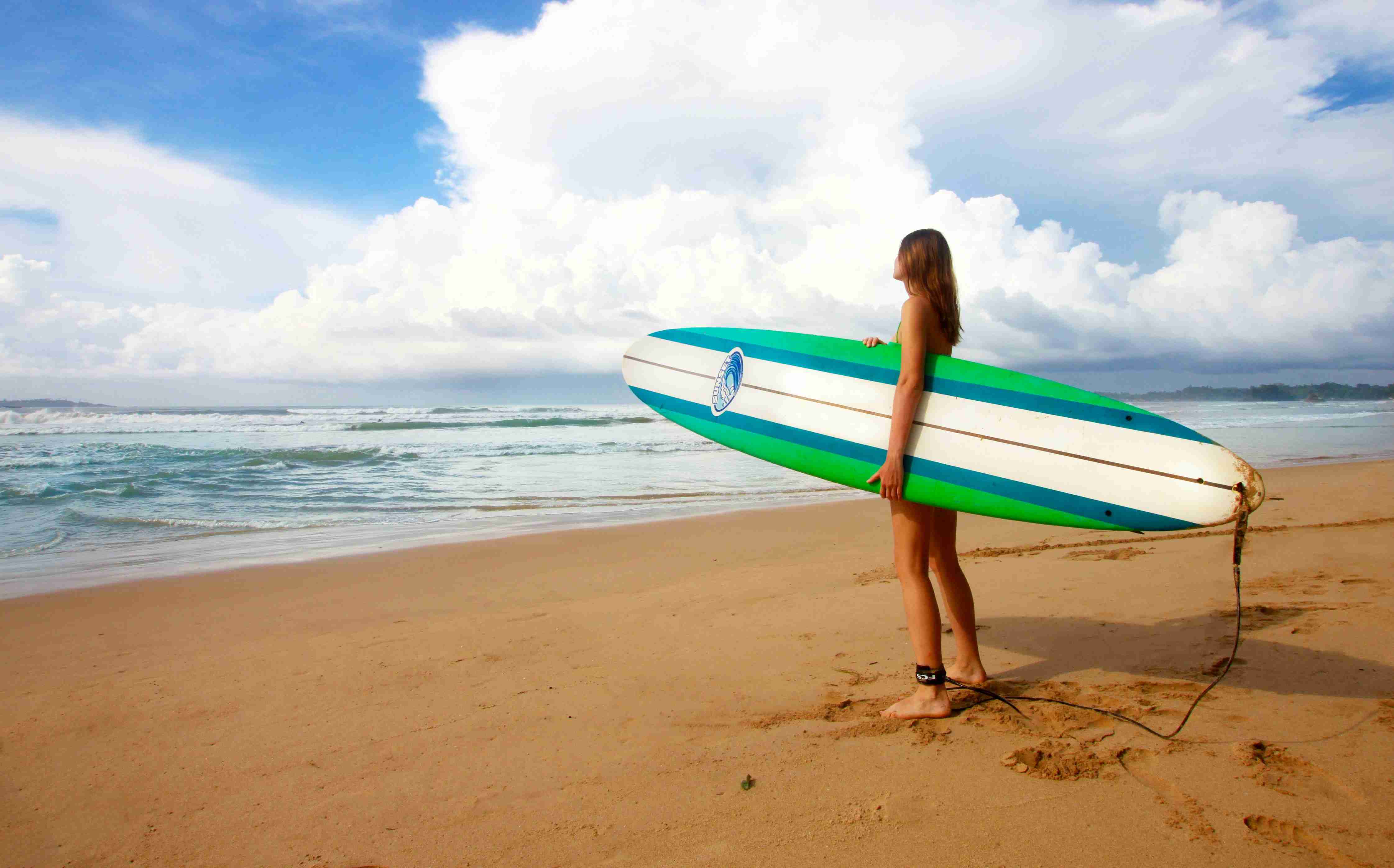 Surfer With Board At Beach