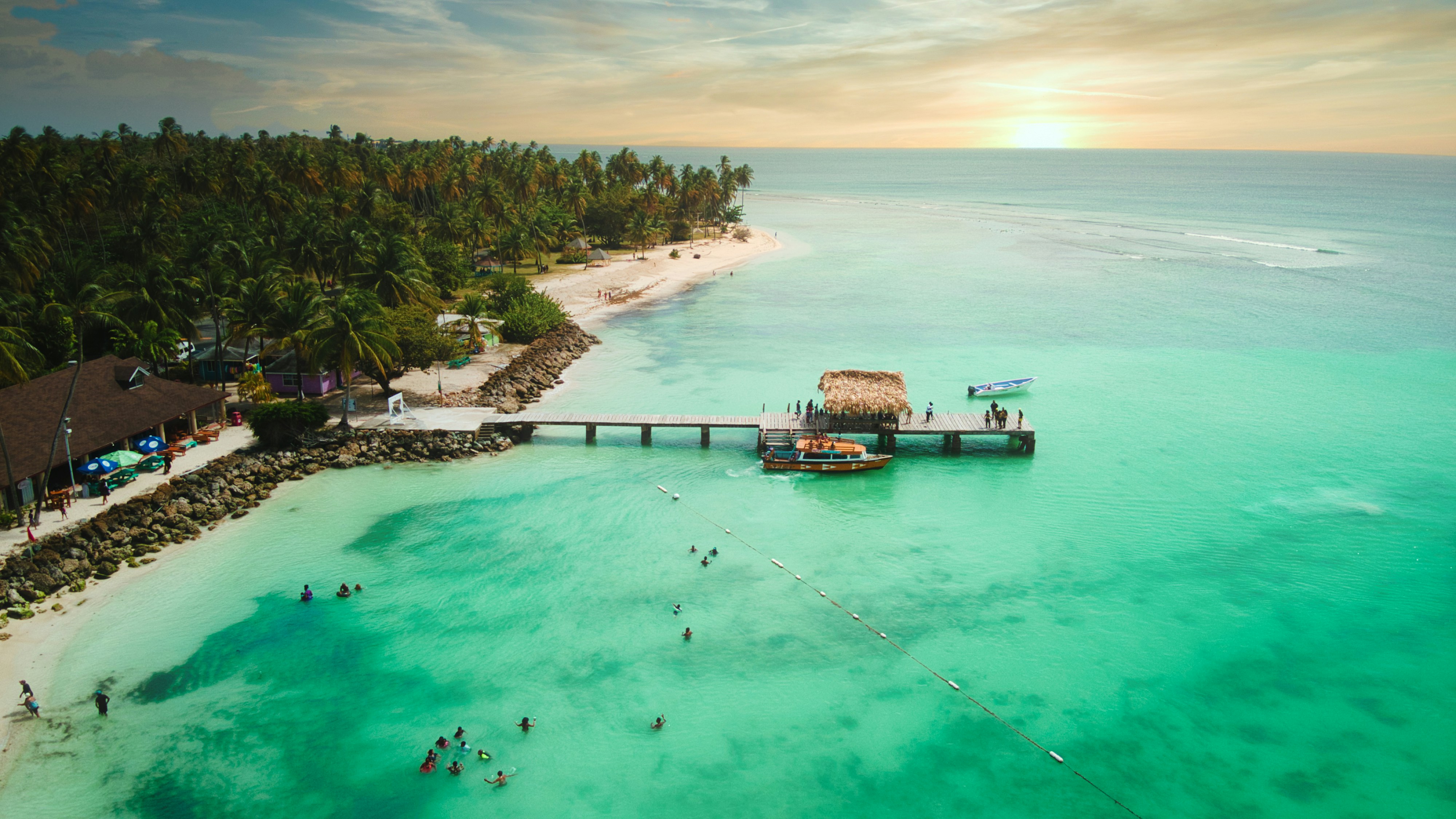 Tropical Paradise Beach with Pier at Sunset