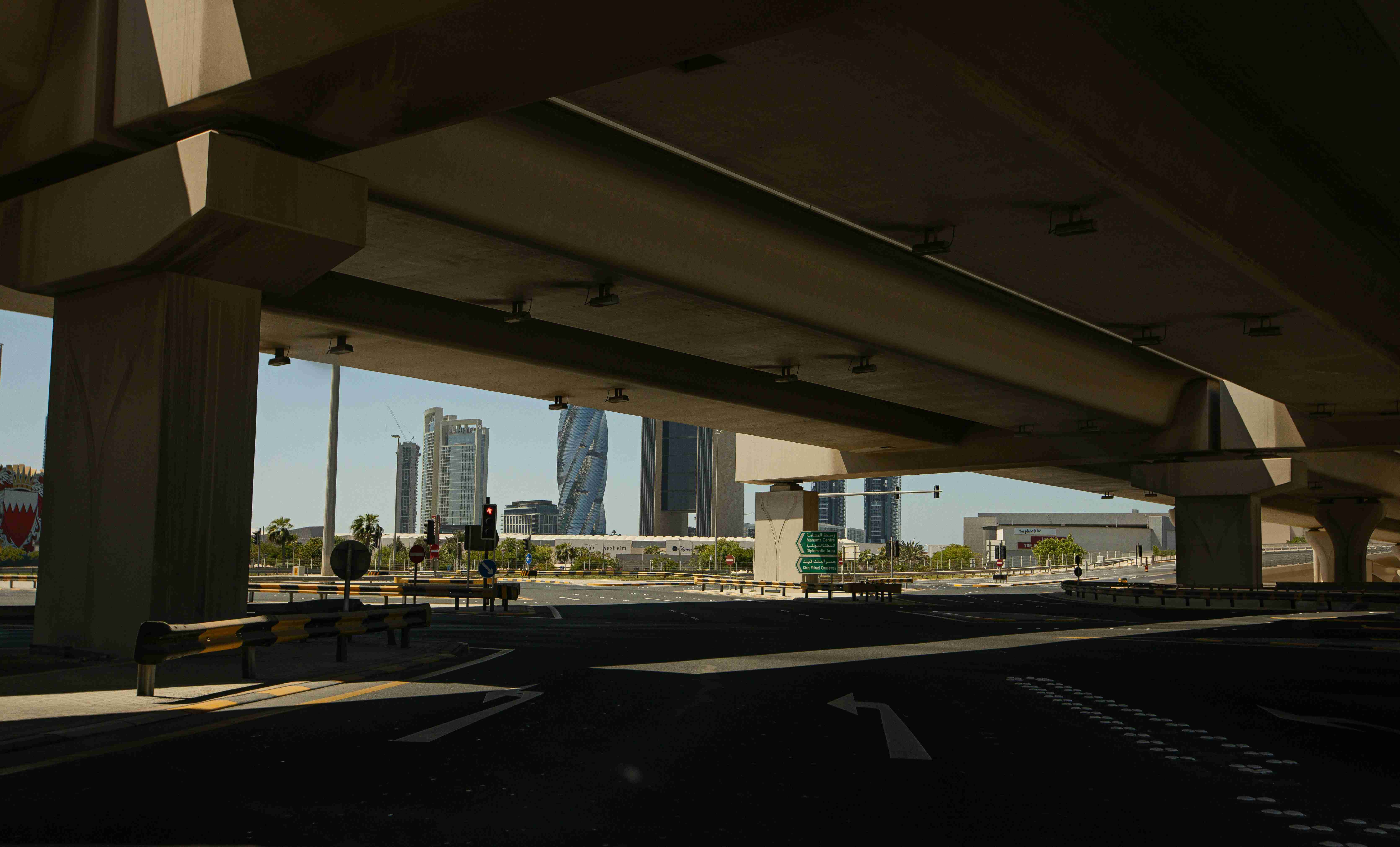 a view of a city from under an overpass