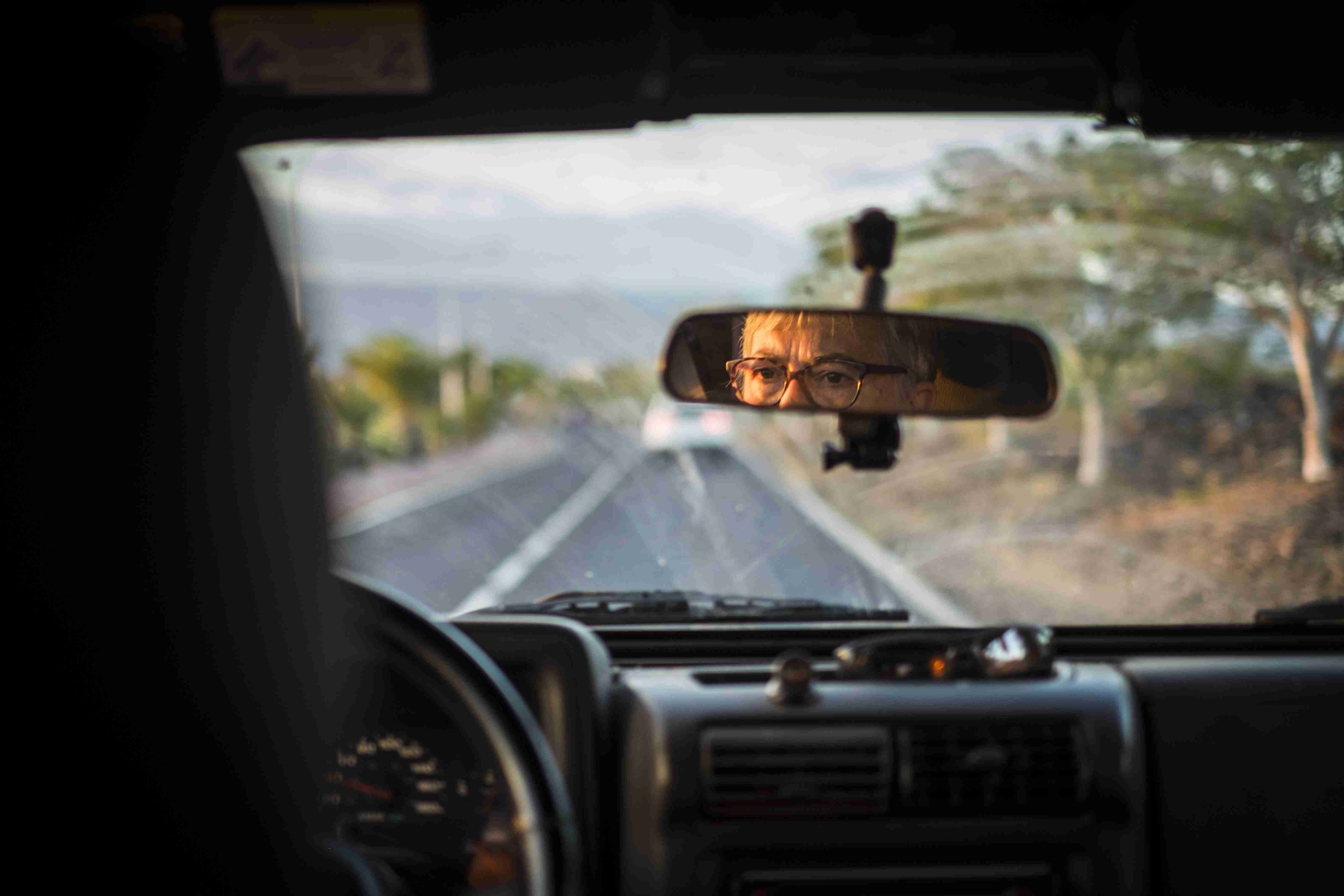 adult senior woman drive the car