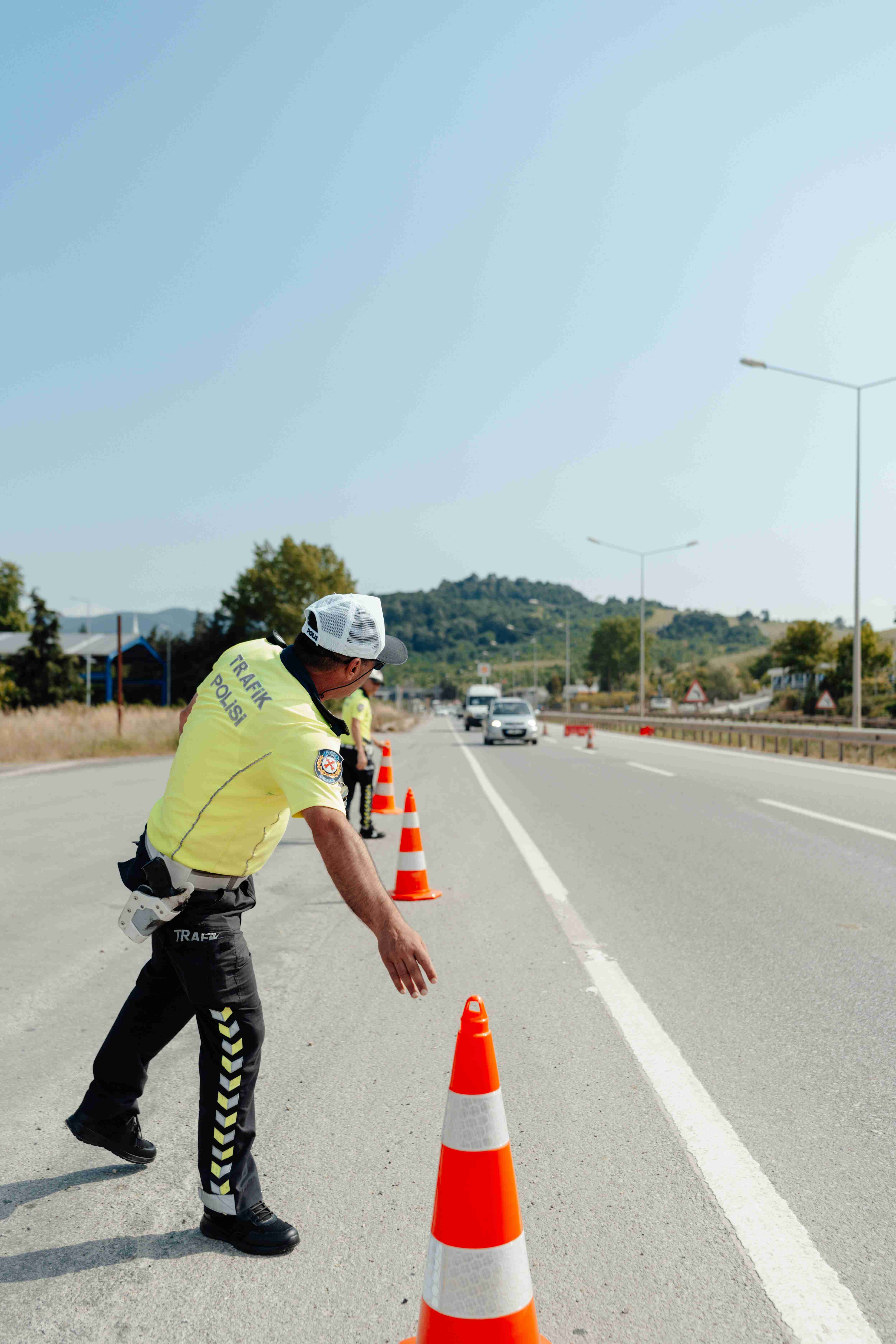Traffic Police Setting Up Road Cones for Safety