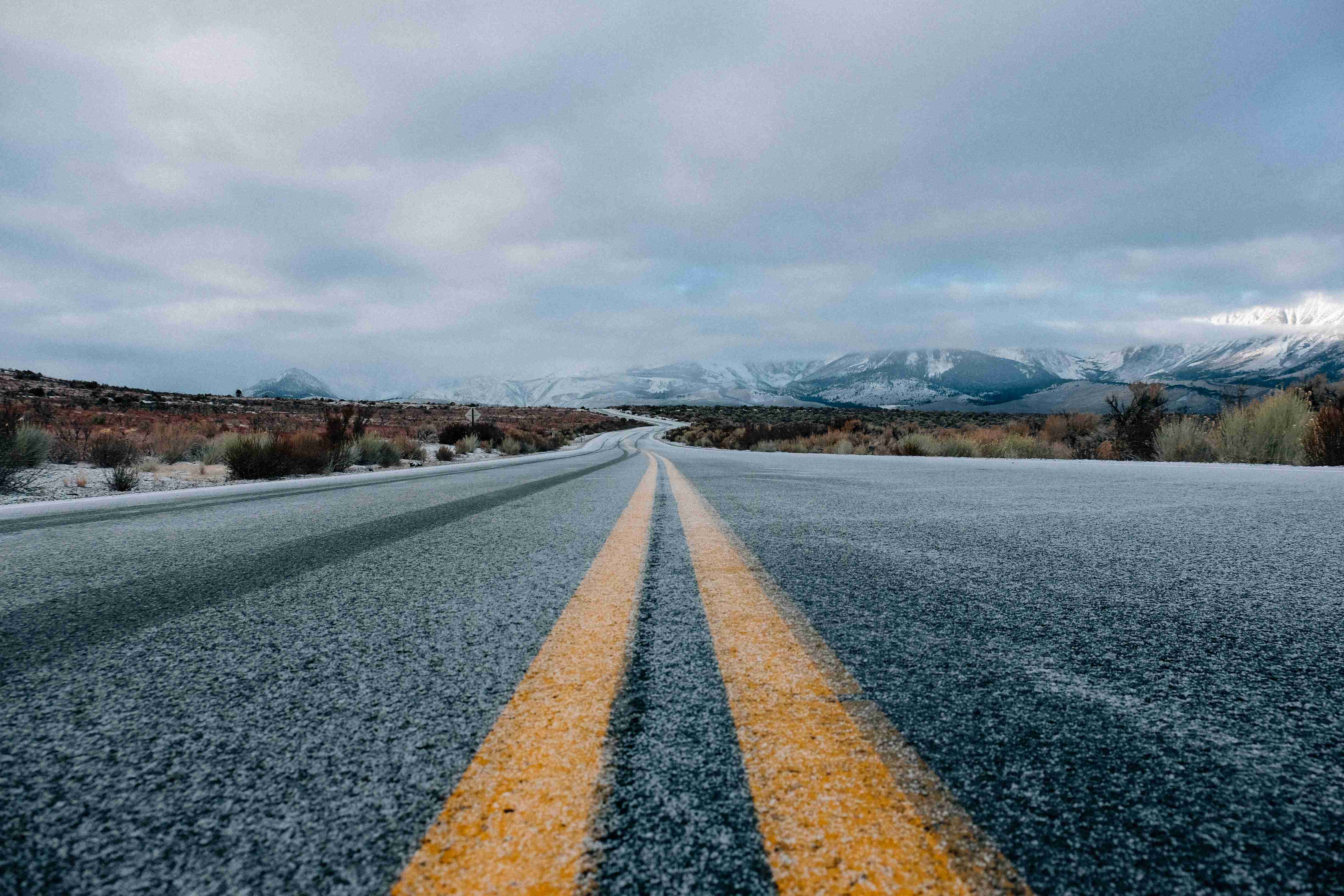 landscape-photography-of-asphalt-road-under-cloudy-sky