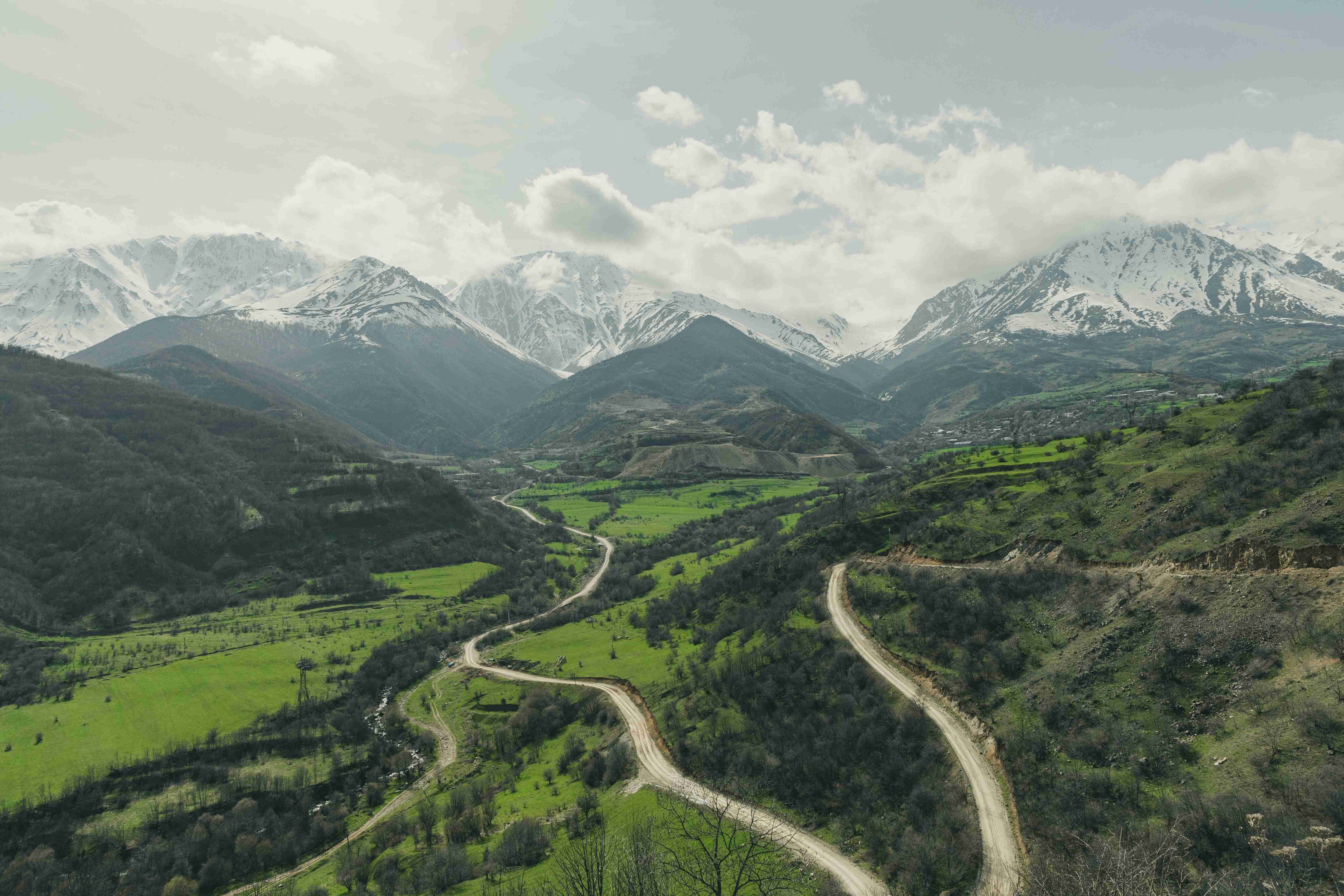 a-scenic-view-of-a-winding-road-in-the-mountains
