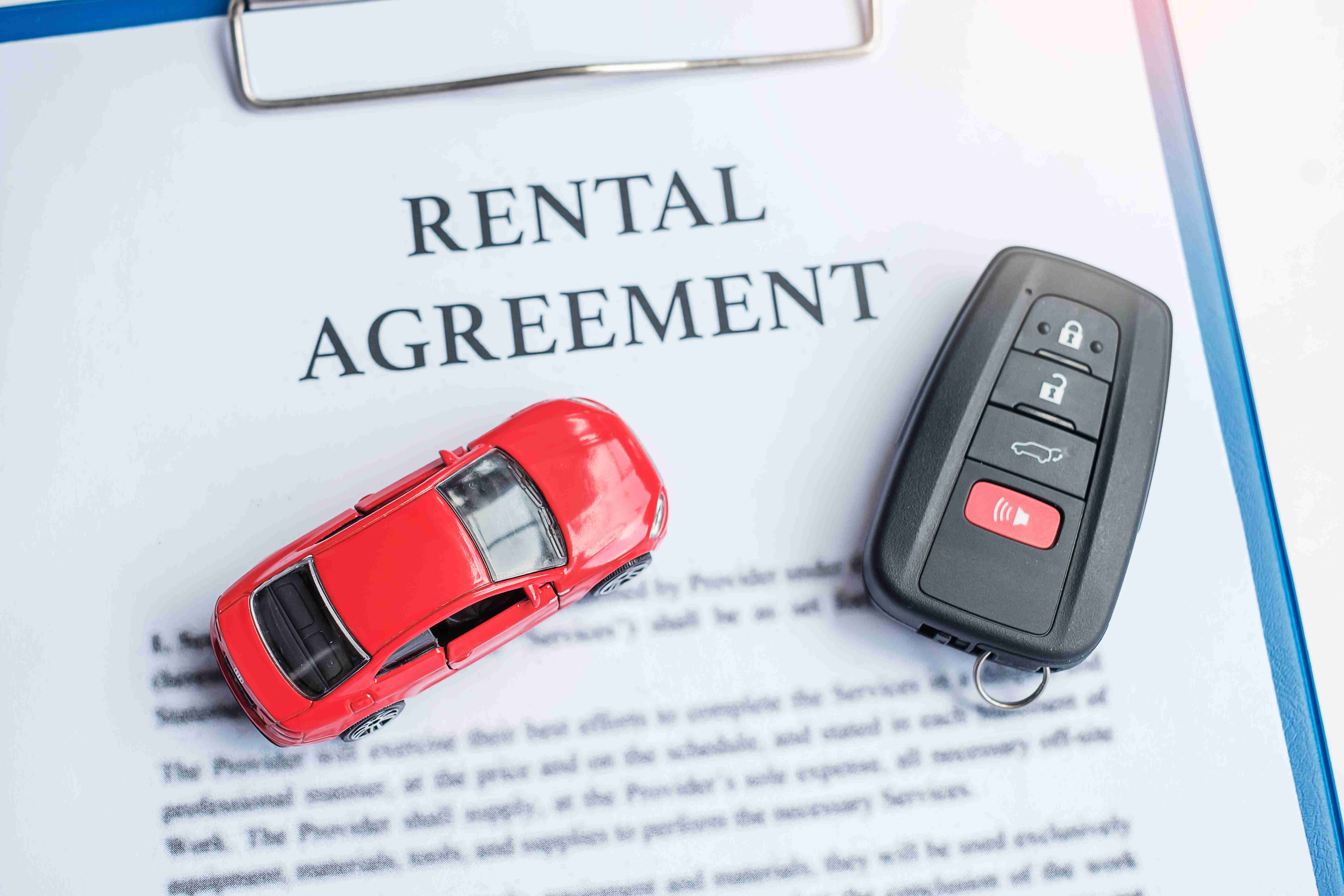 contract document with car and remote key