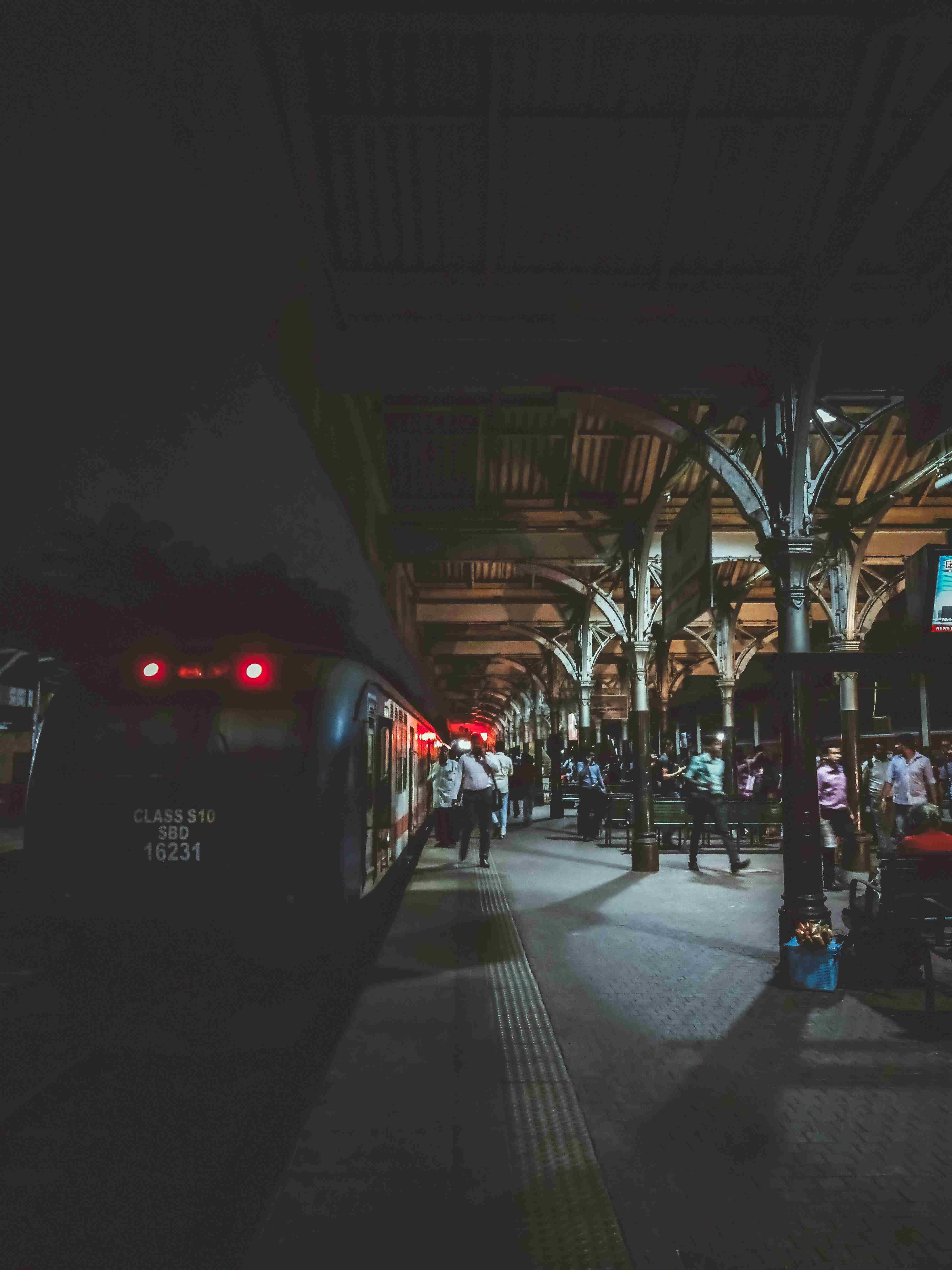 Train Station at Night with Passengers Boarding