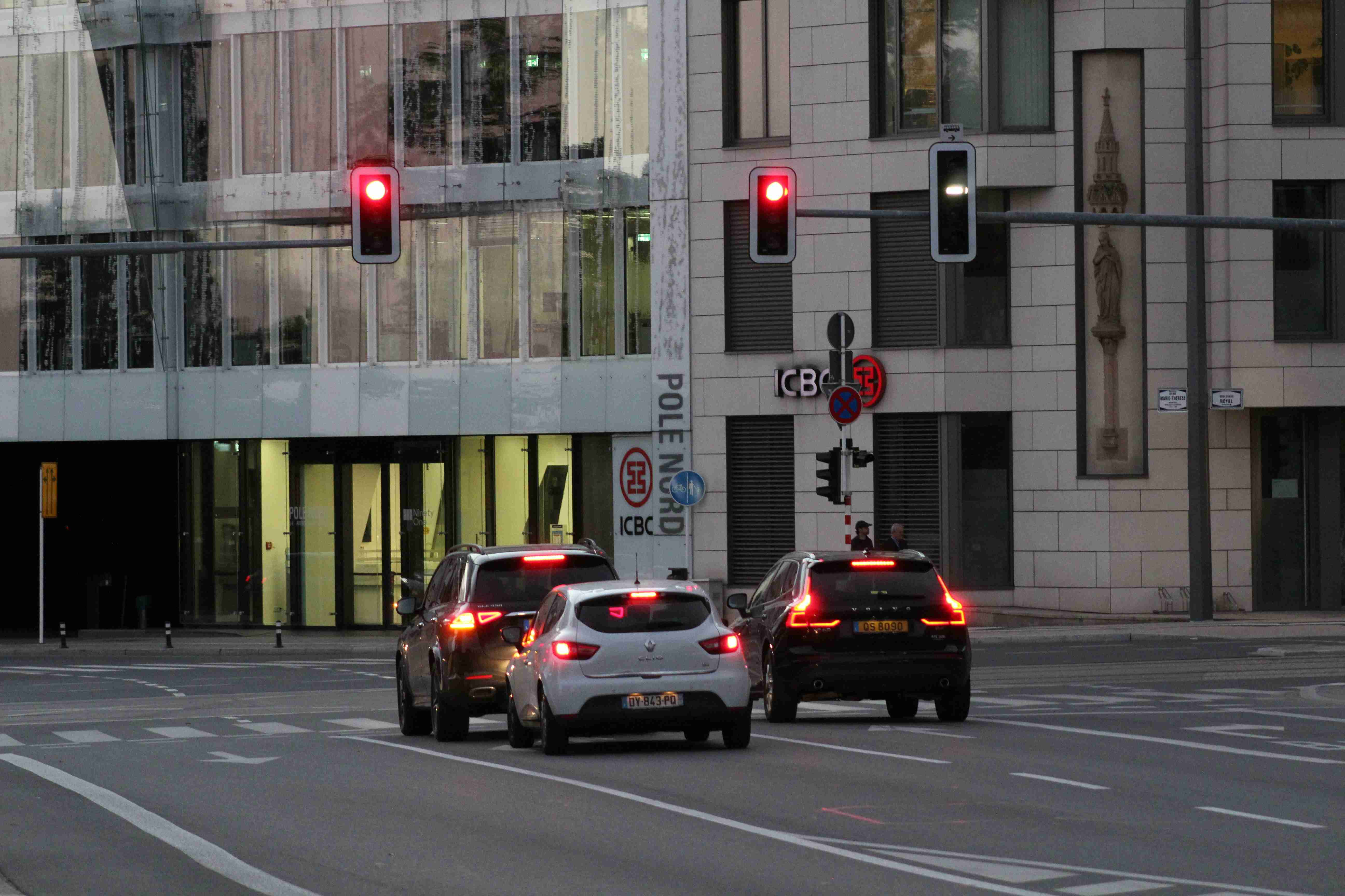 a couple of cars that are sitting in the street