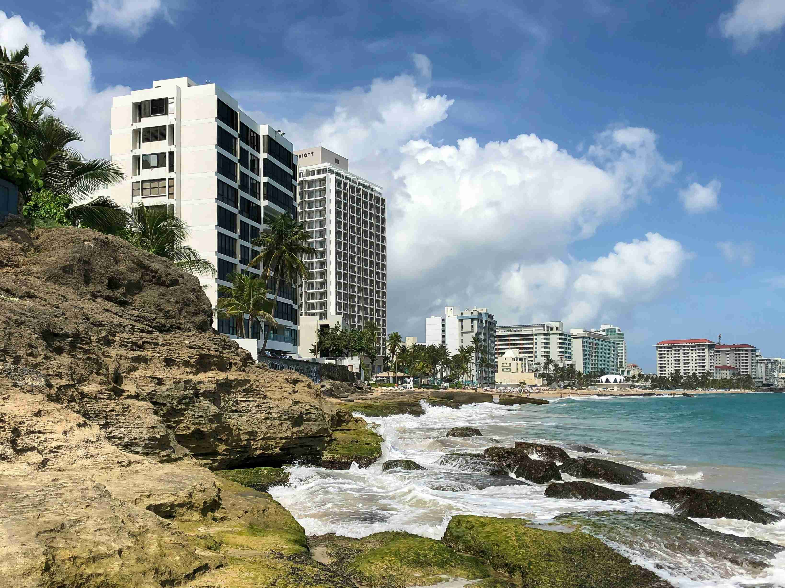 white and black concrete buildings under blue sky