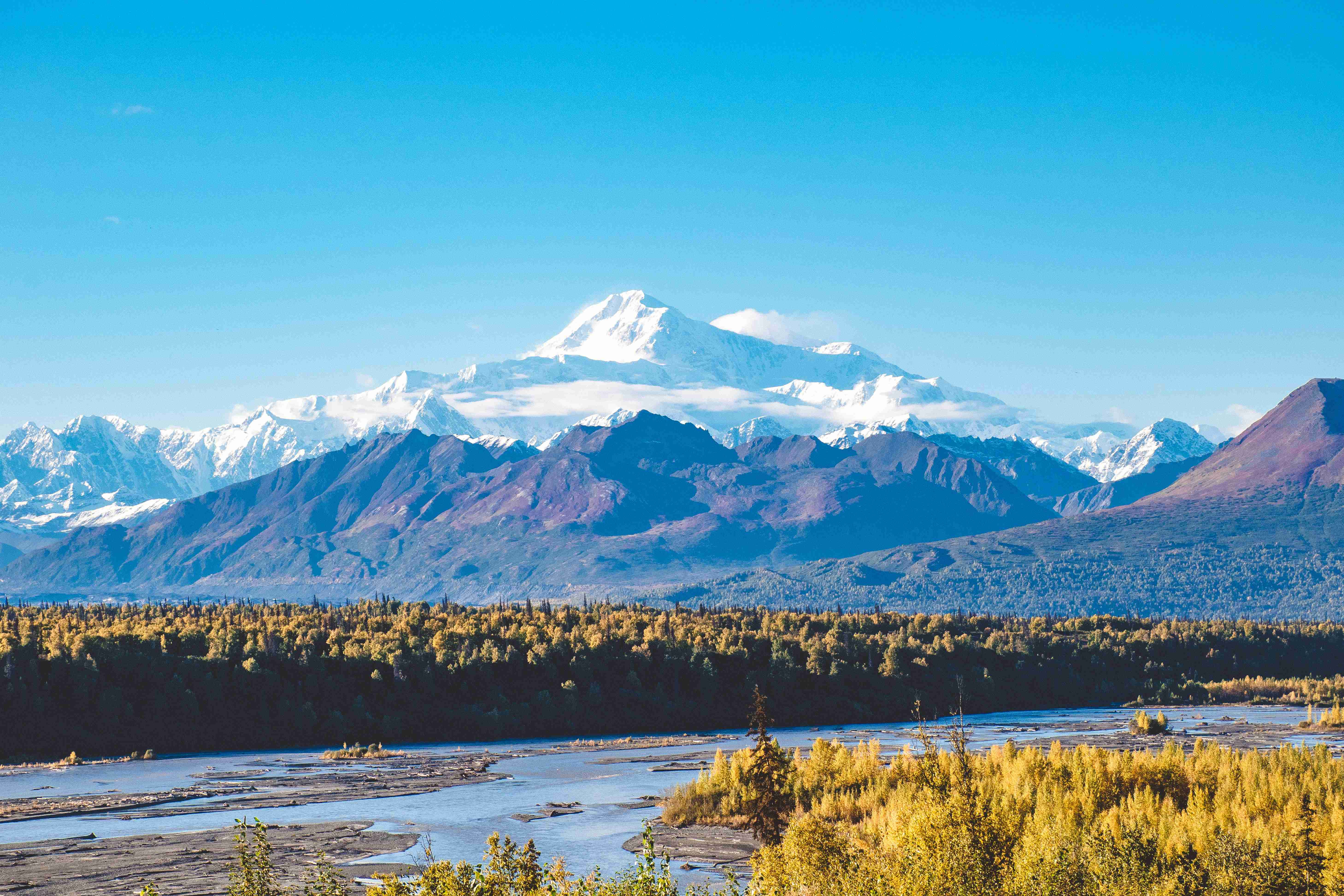snow covered mountain during daytime
