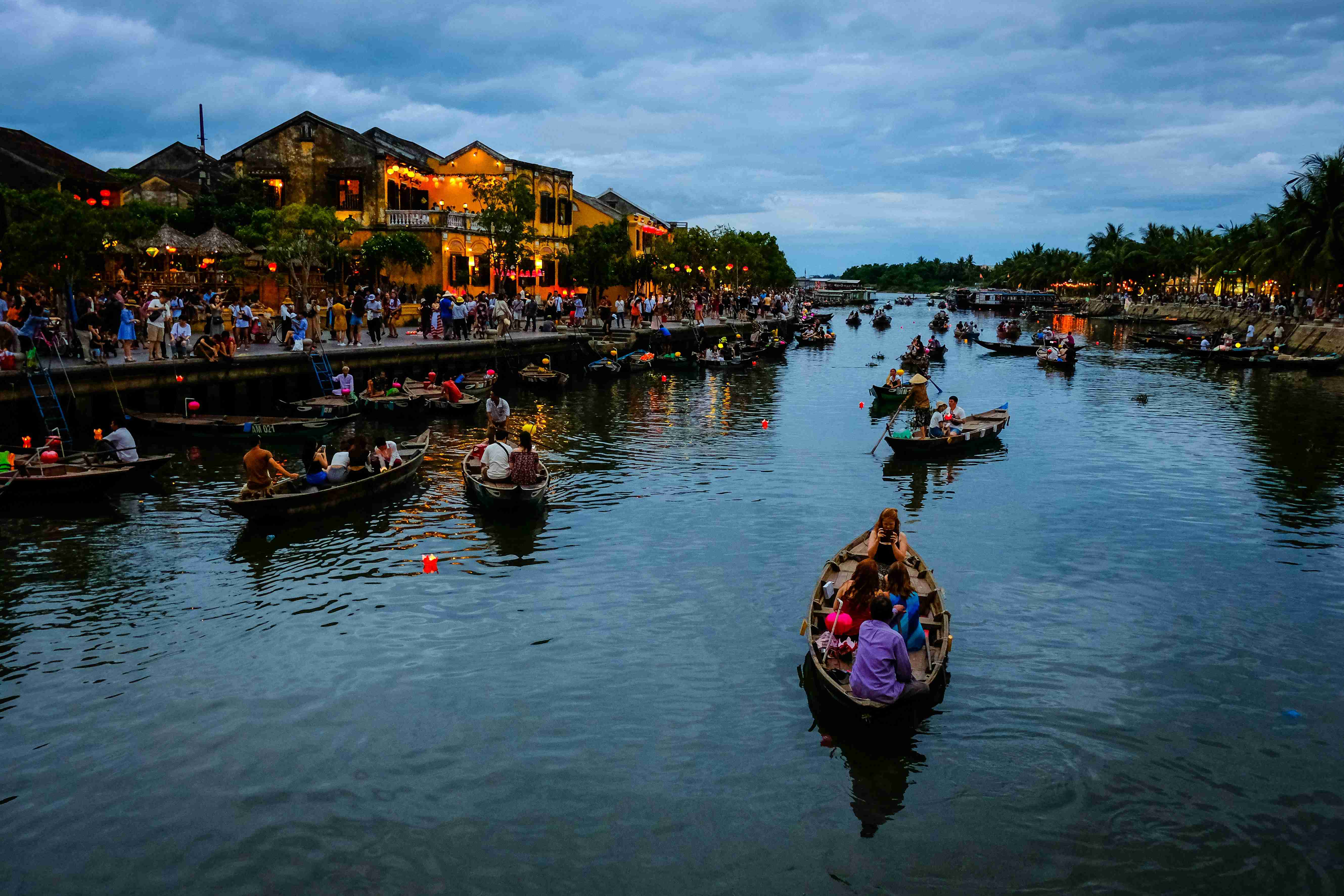 people riding on boat on river during daytime