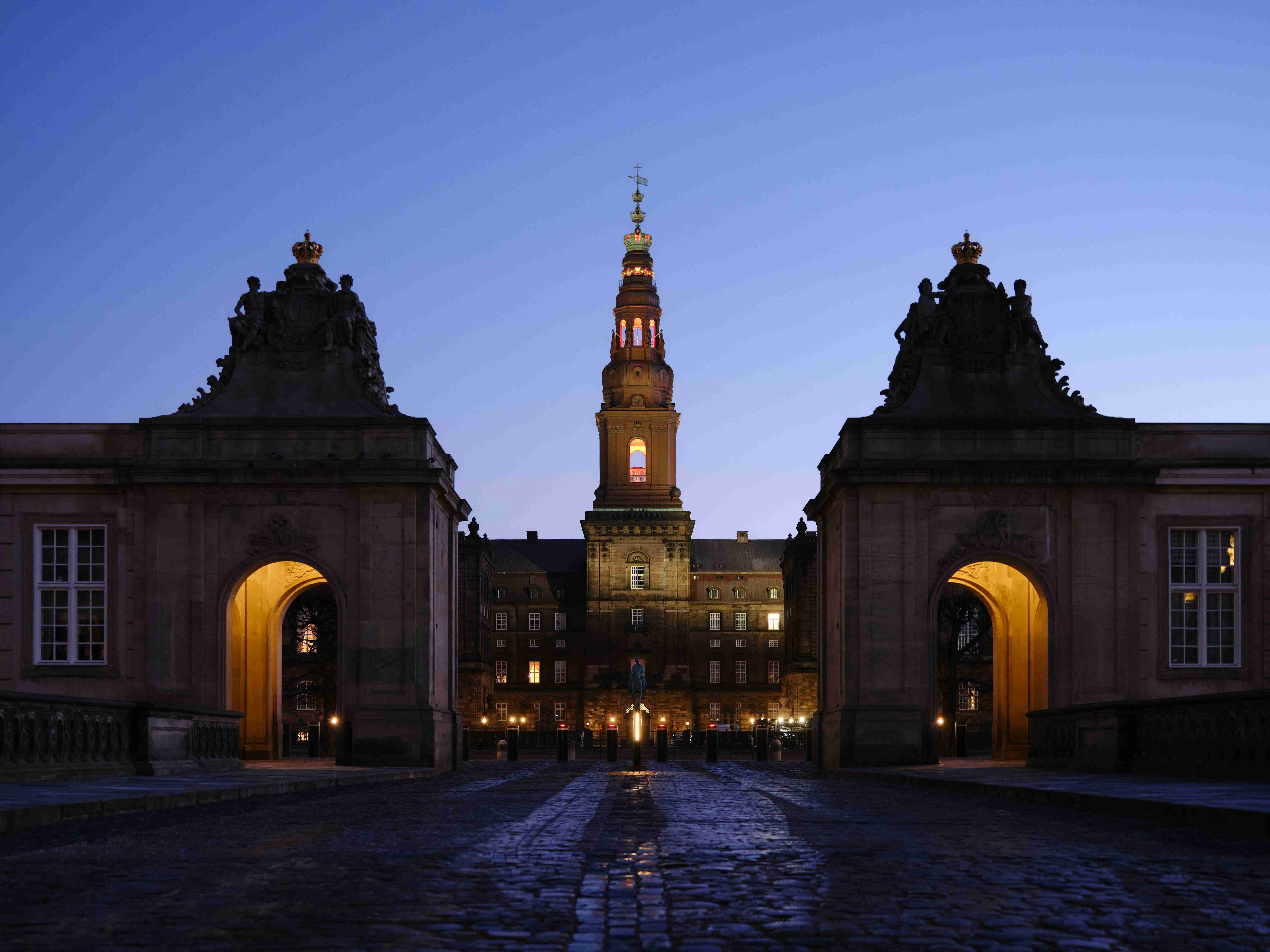 a-large-building-with-a-clock-tower-at-night