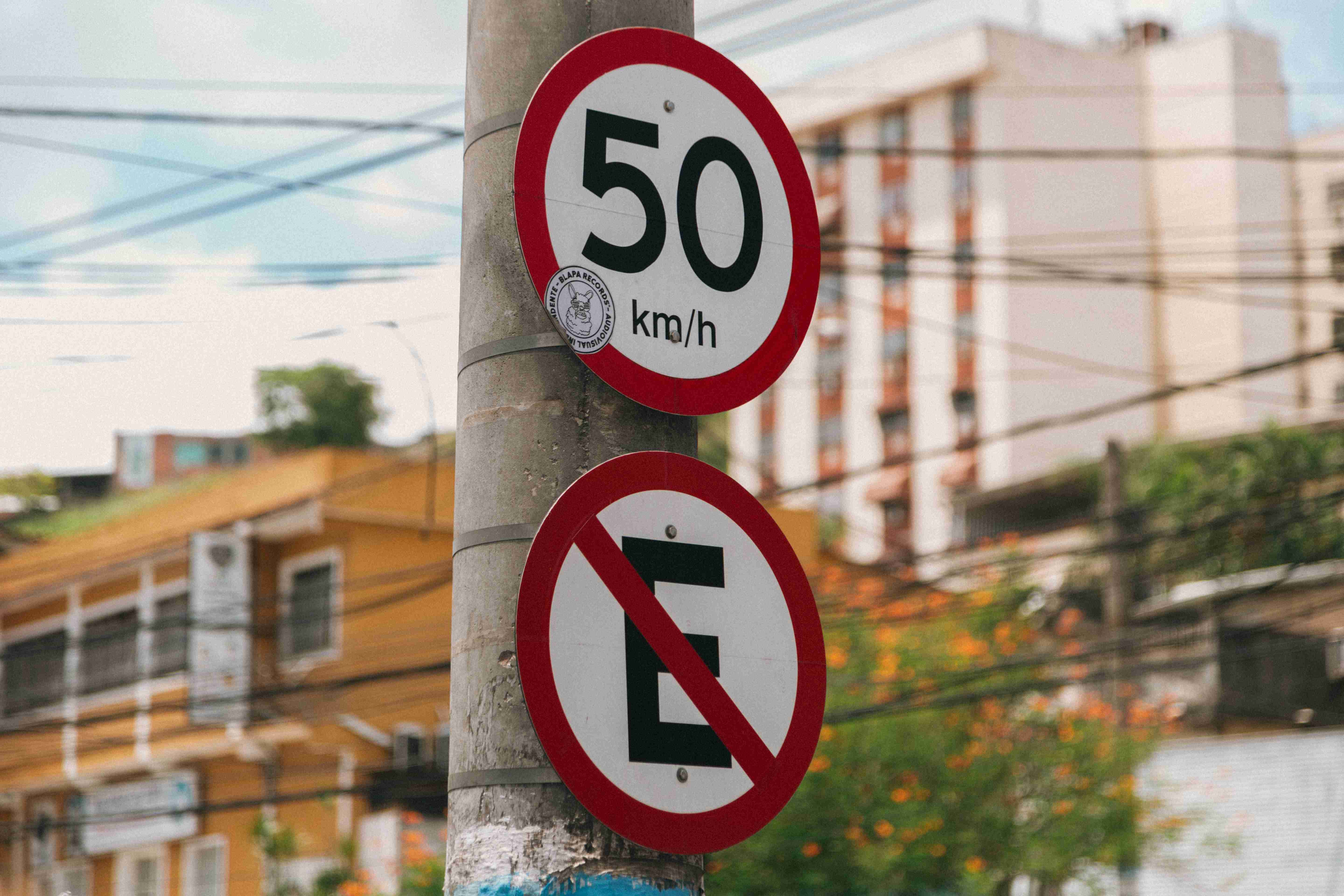 low-angle-shot-of-street-signs-fixed-to-a-pole