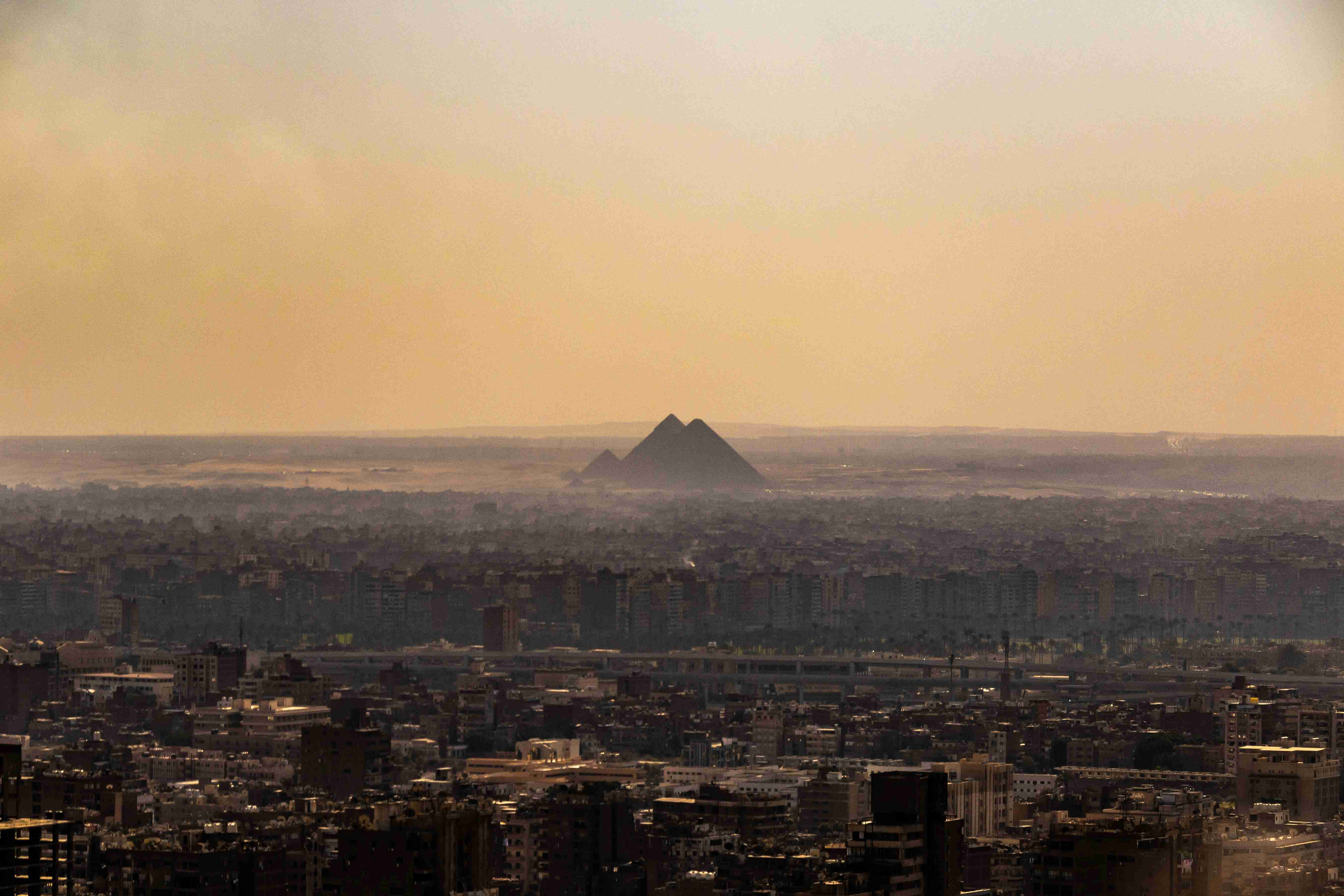a view of a city with a pyramid