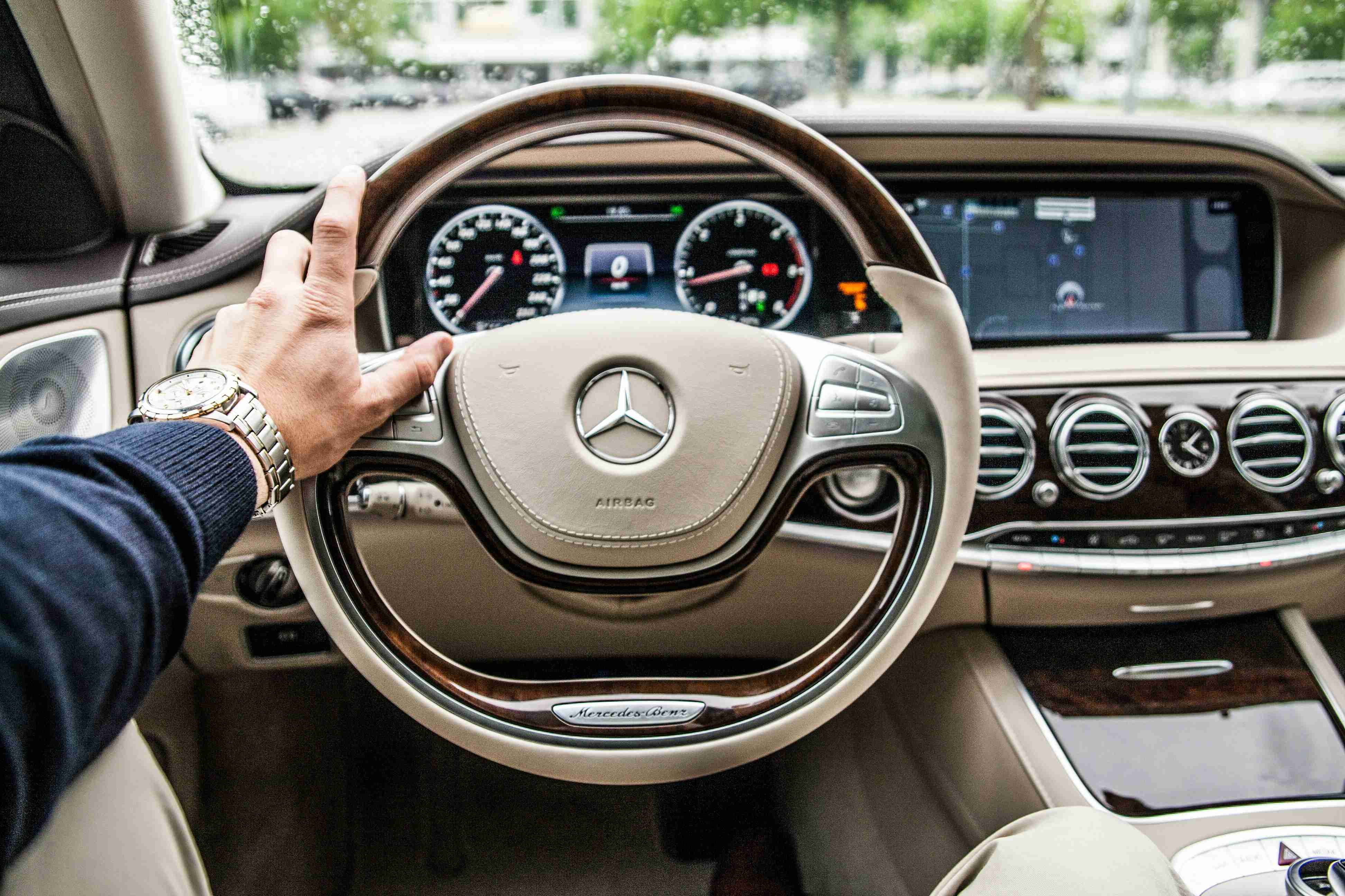 person sitting in mercedes benz driver seat