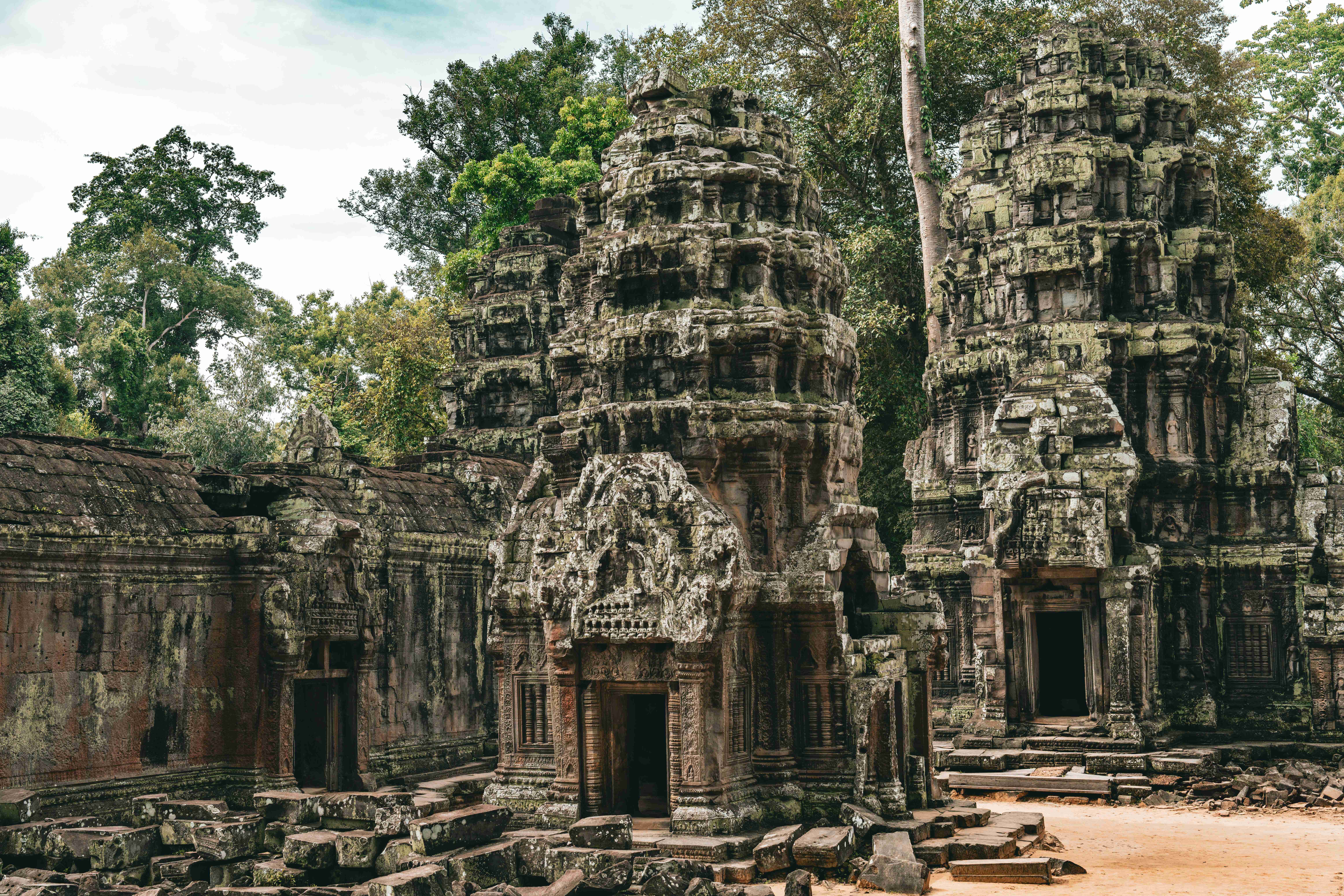 a-group-of-stone-buildings-with-trees-in-the-background