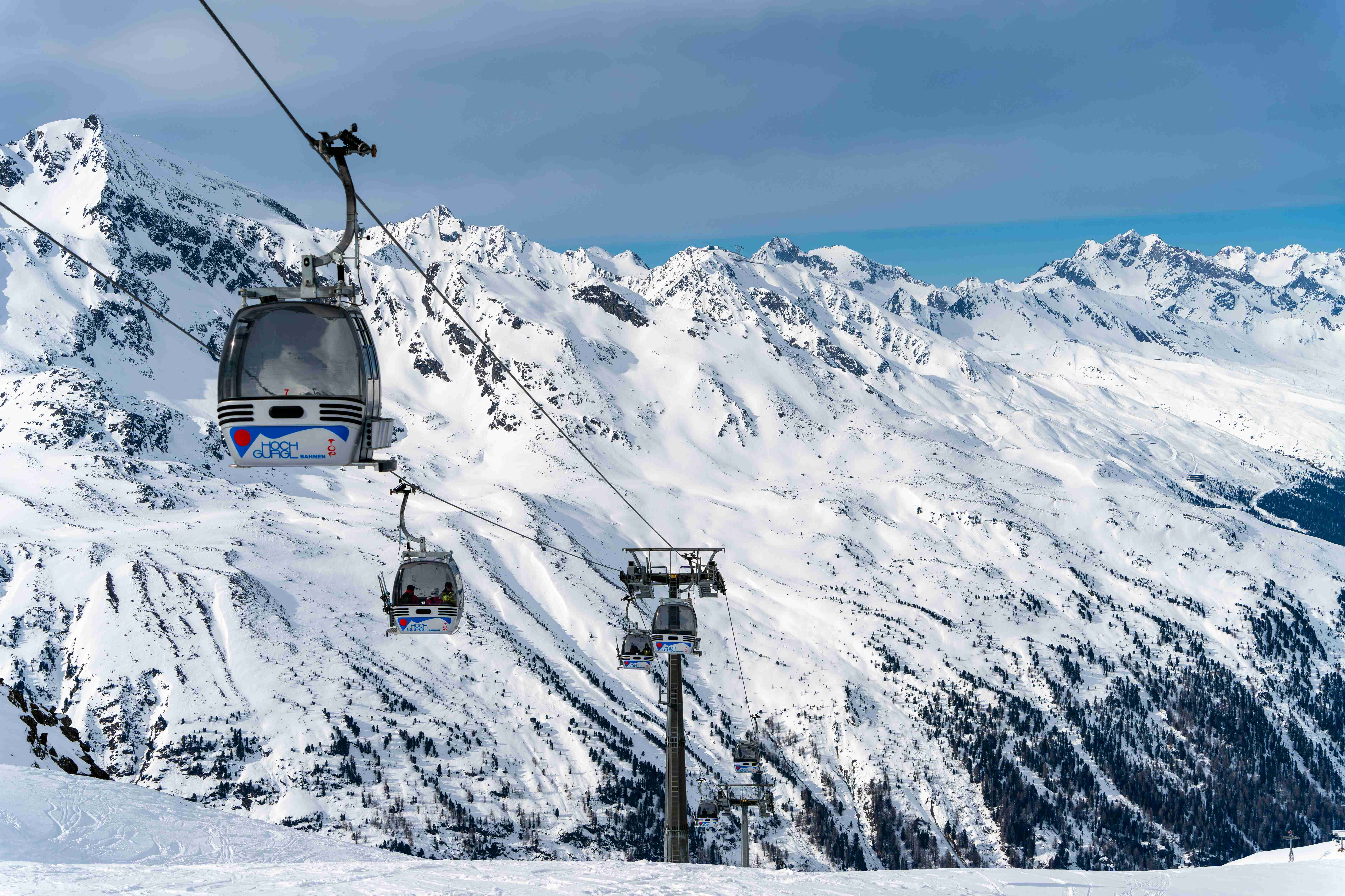 a-ski-lift-going-up-the-side-of-a-snow