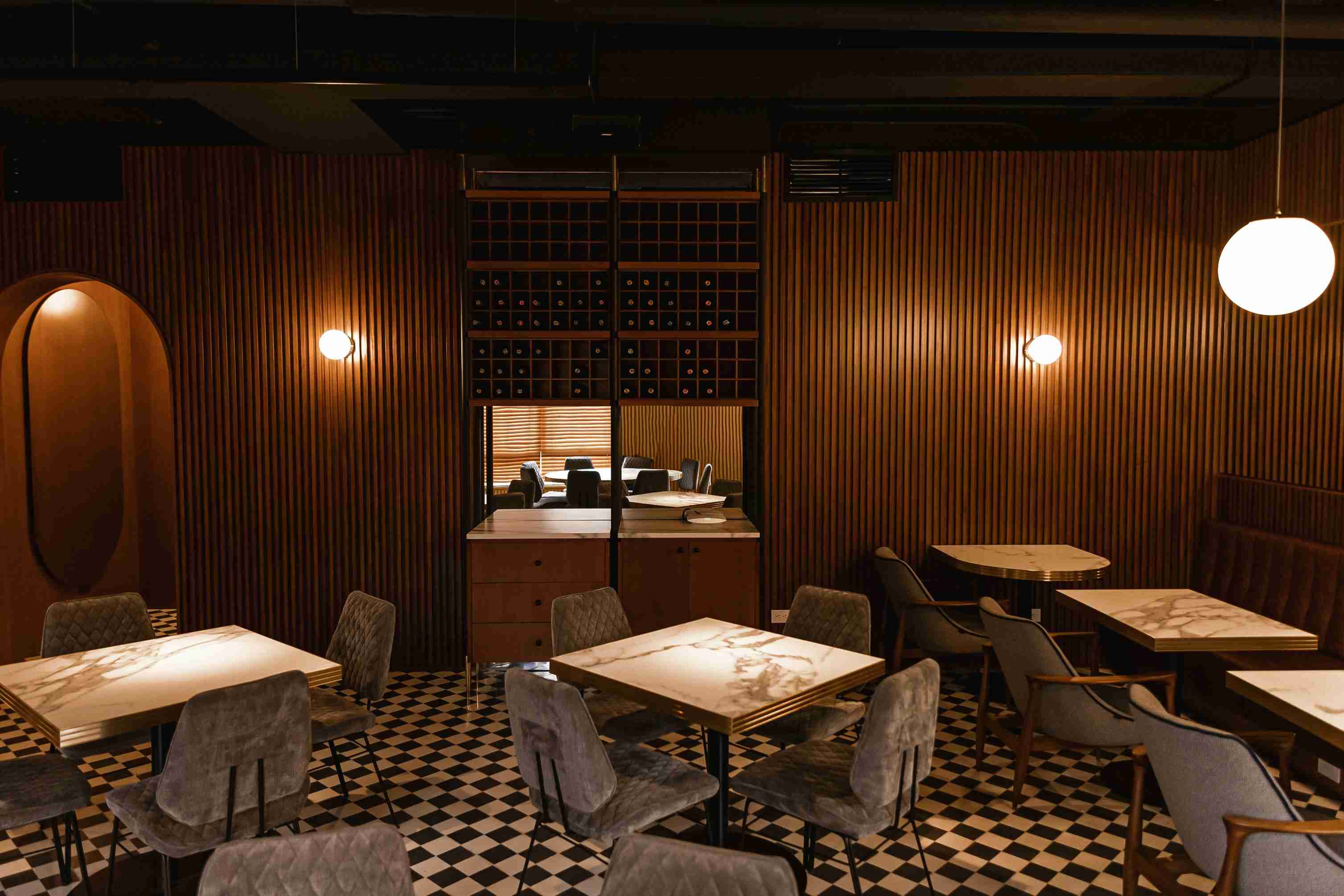 a-restaurant-with-a-checkered-floor-and-wooden-walls
