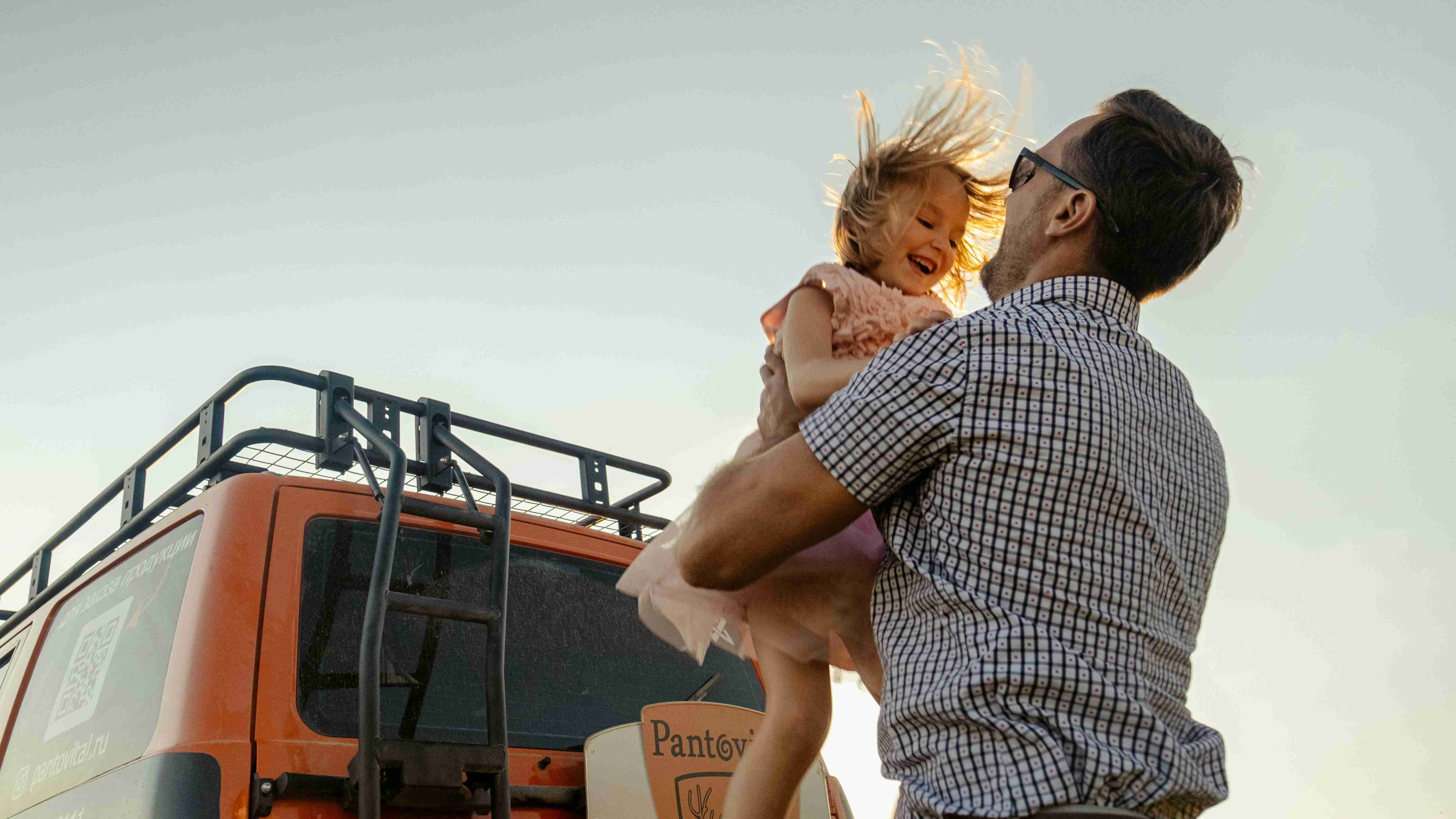 father picking up his daughter