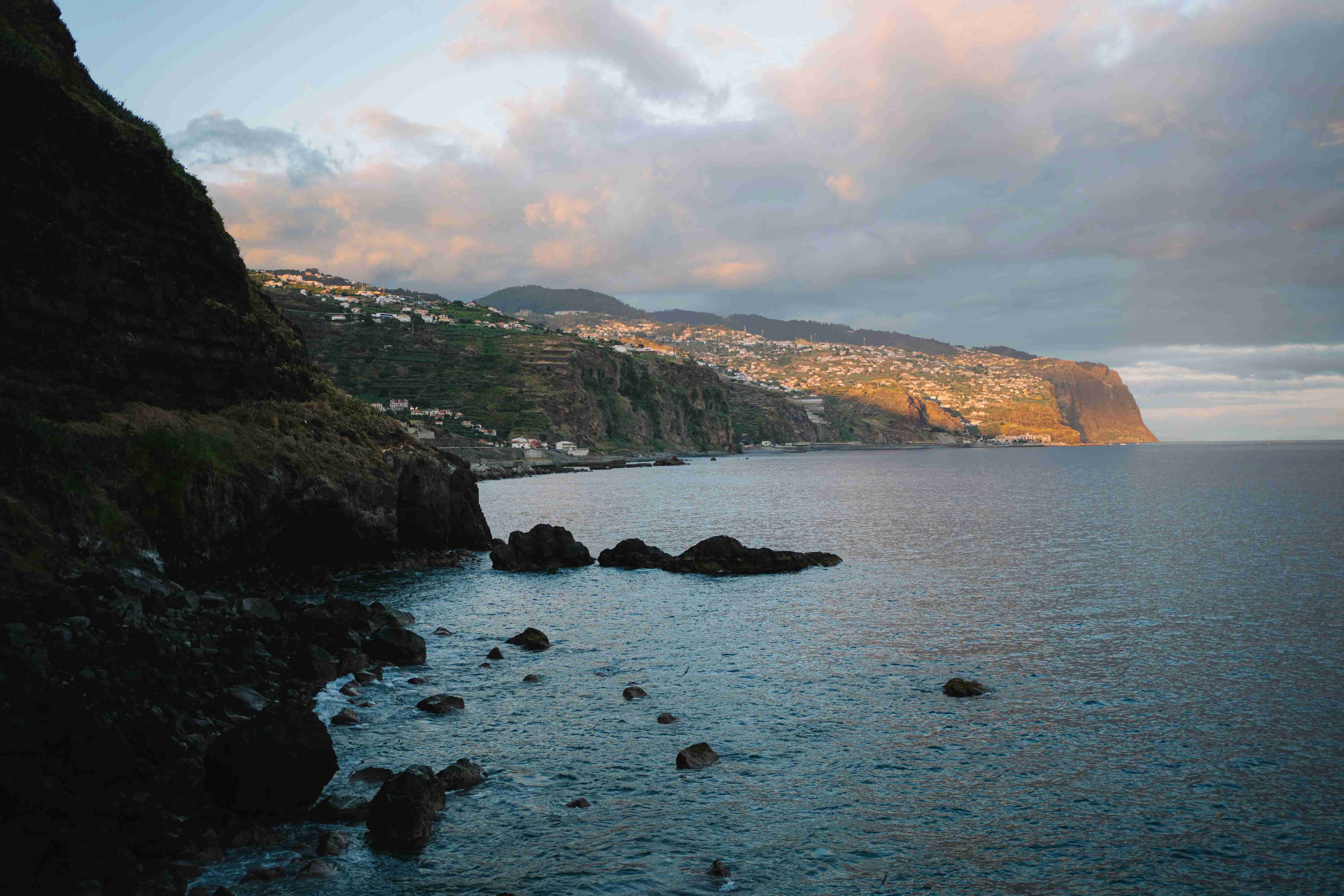 a view of the ocean and cliffs