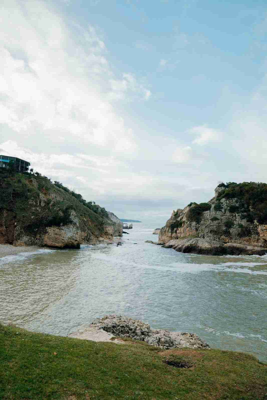 Scenic Coastal View with Cliffs and Calm Waters