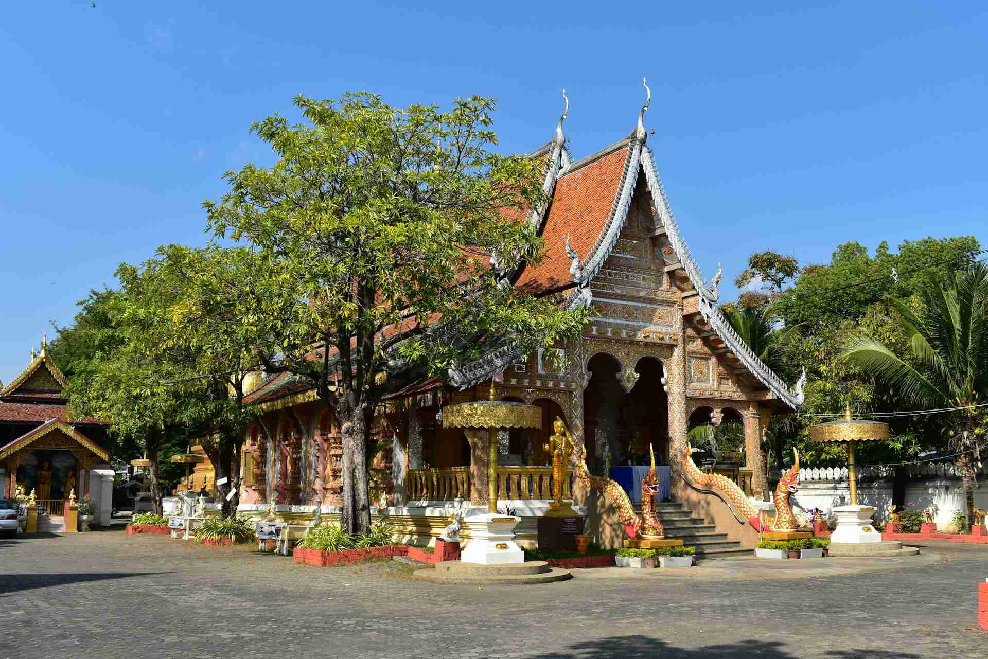 A temple with intricate architecture, golden statues in Chiang Mai, Thailand