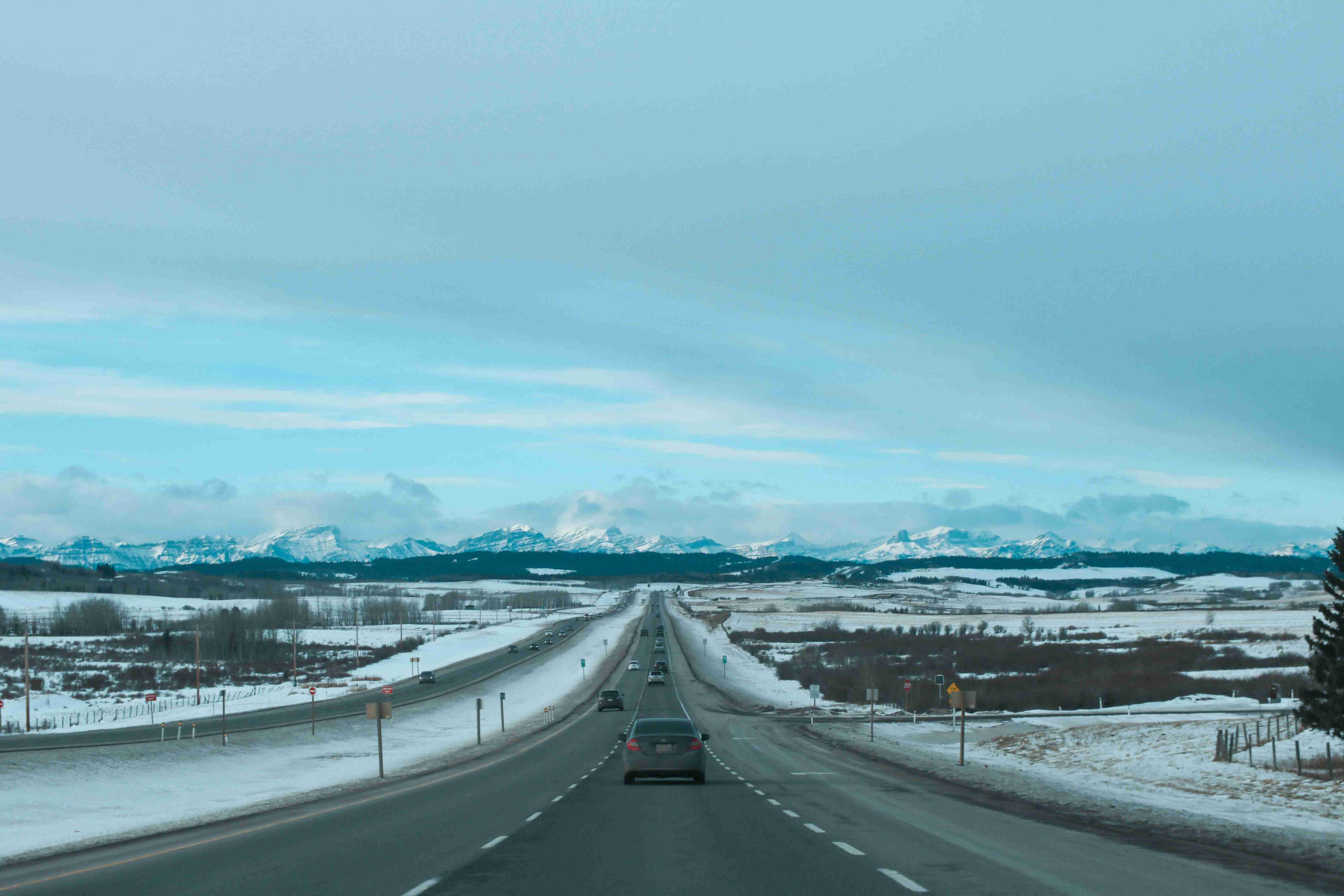gray concrete road under blue sky