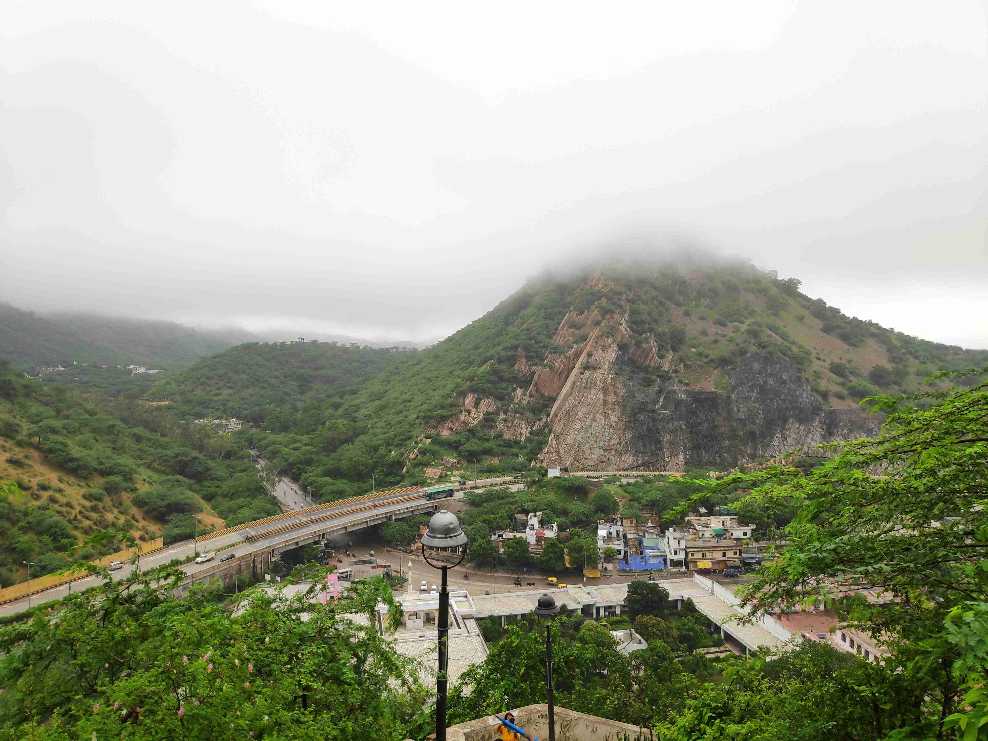 green mountain under white sky