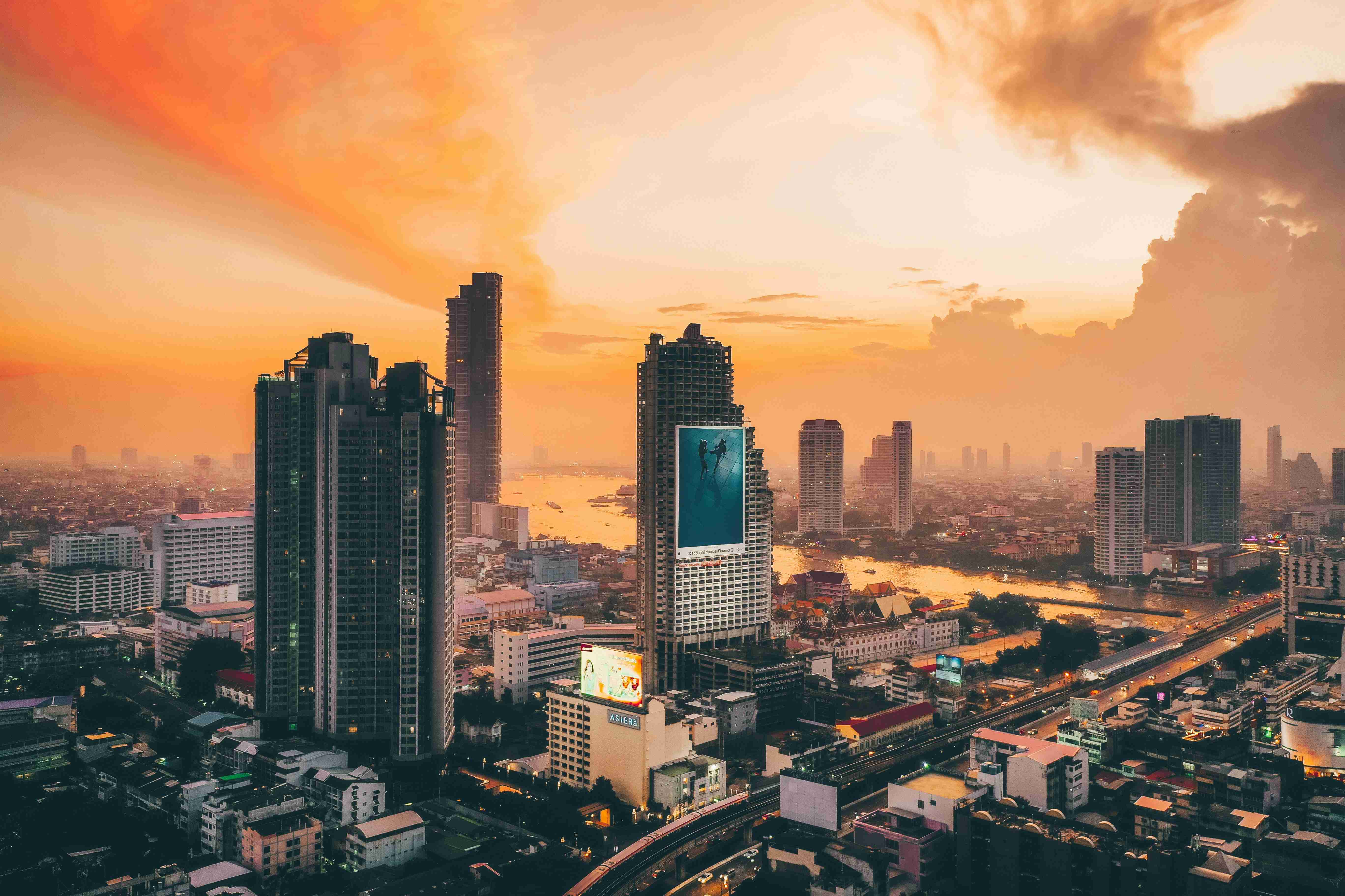 Sunset over Bangkok skyline with Chao Phraya River in view