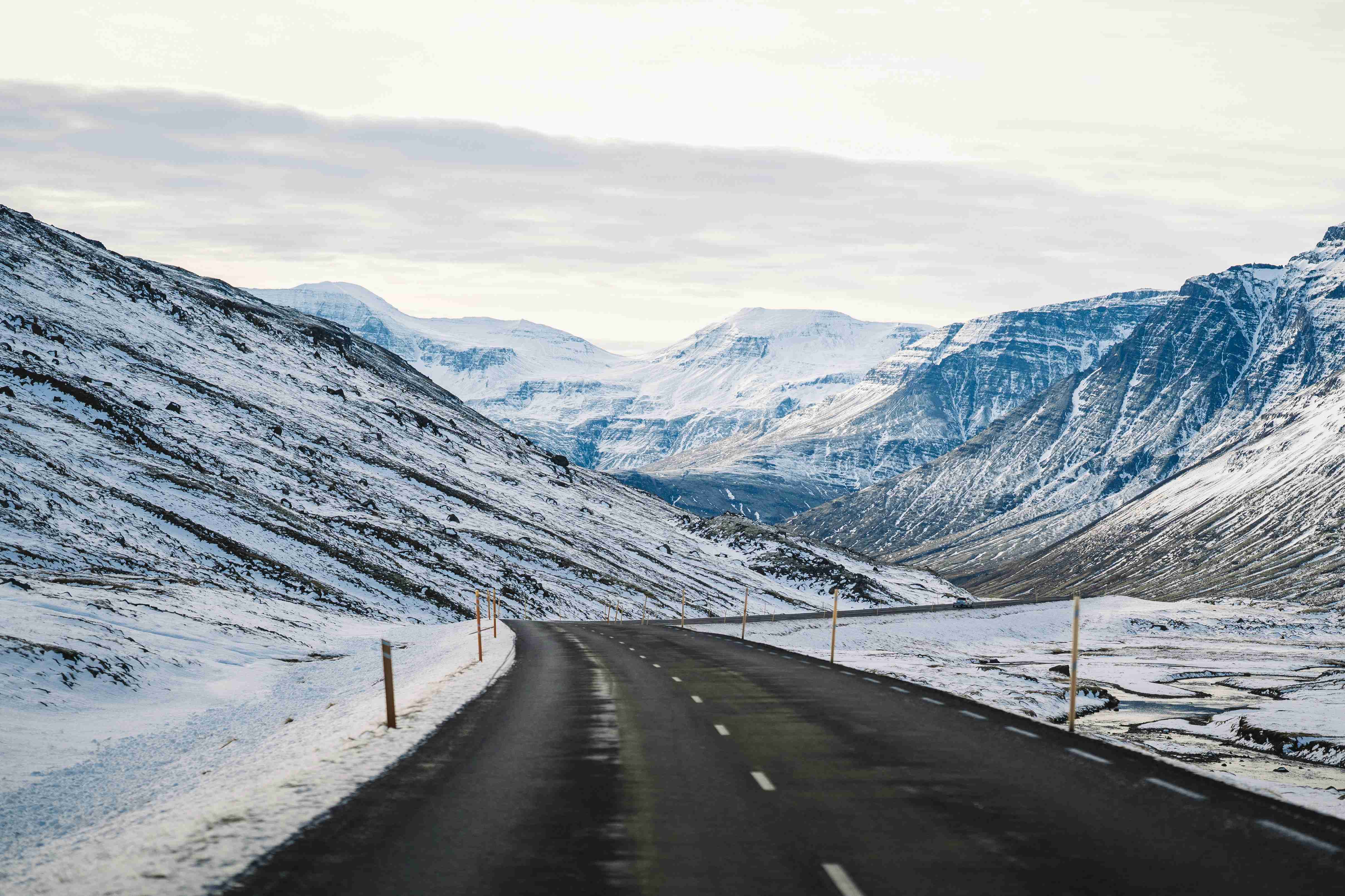 a road in the middle of a snowy mountain