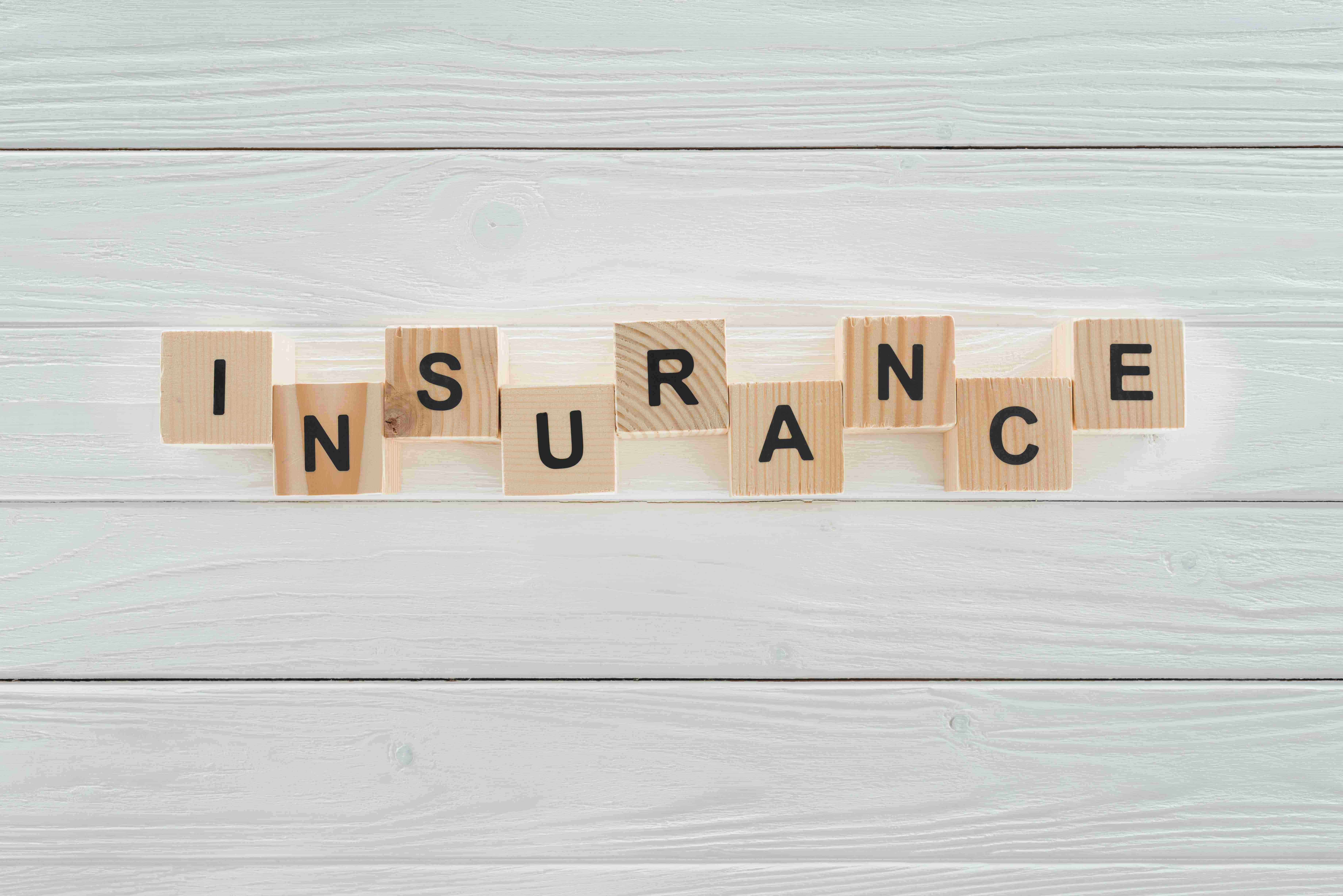 top-view-of-insurance-word-made-of-wooden-blocks