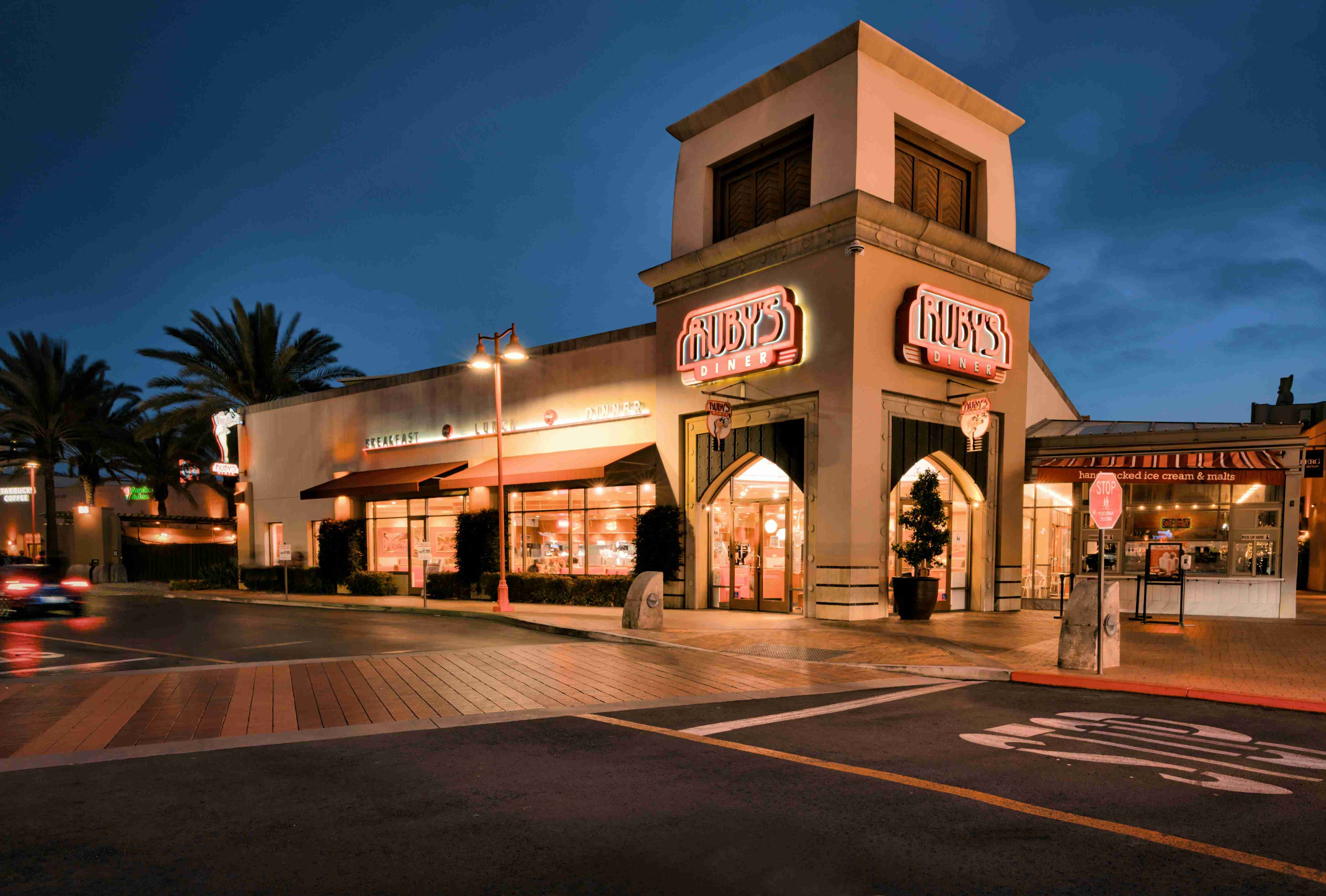 brown-and-white-concrete-building-during-night-time