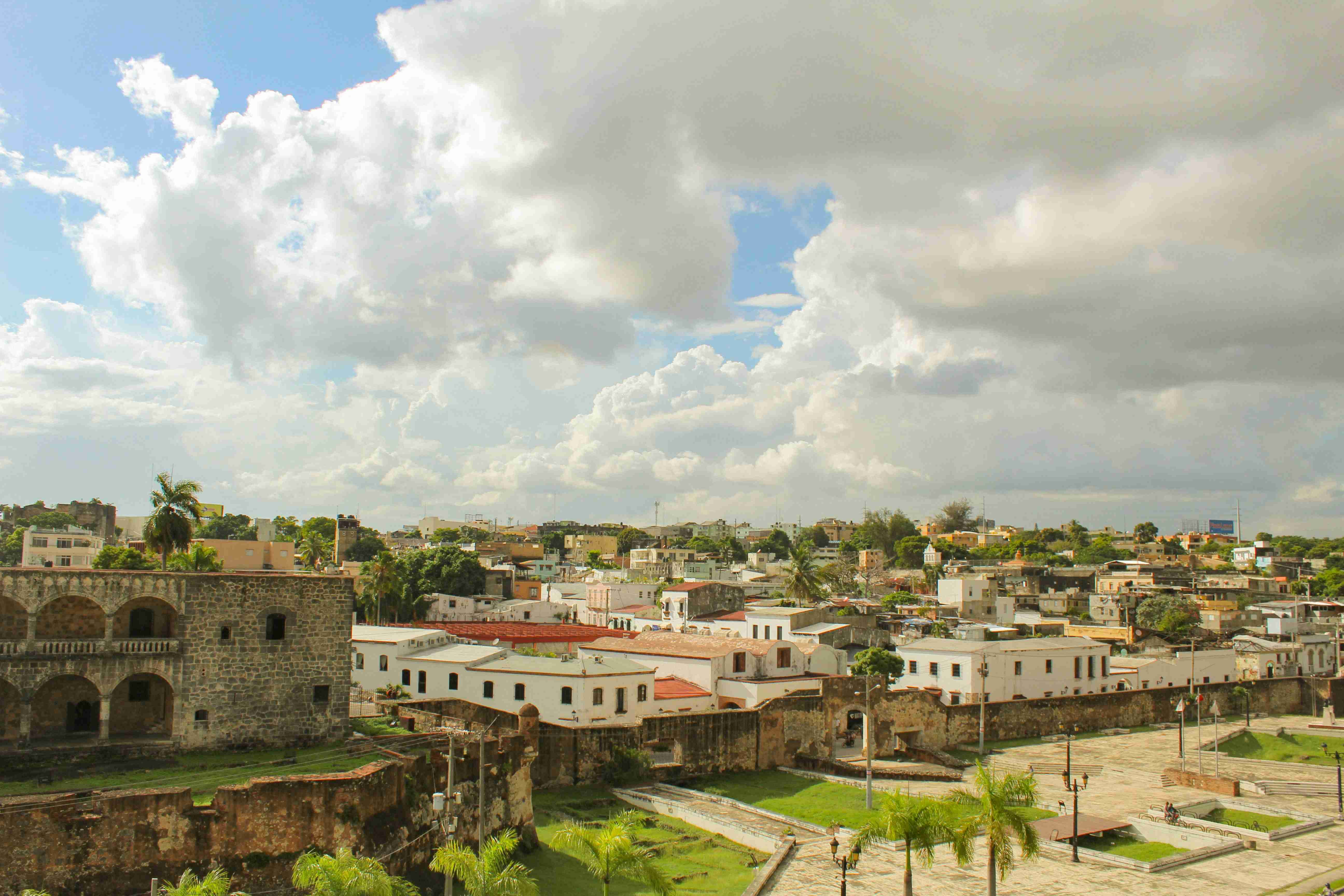 white and brown concrete buildings under white clouds