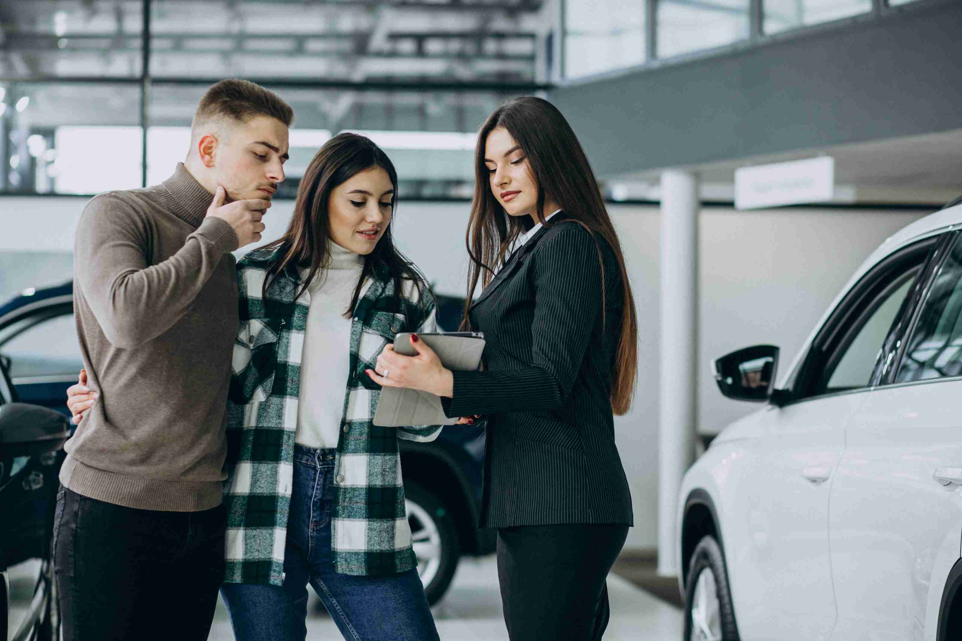 young couple choosing car